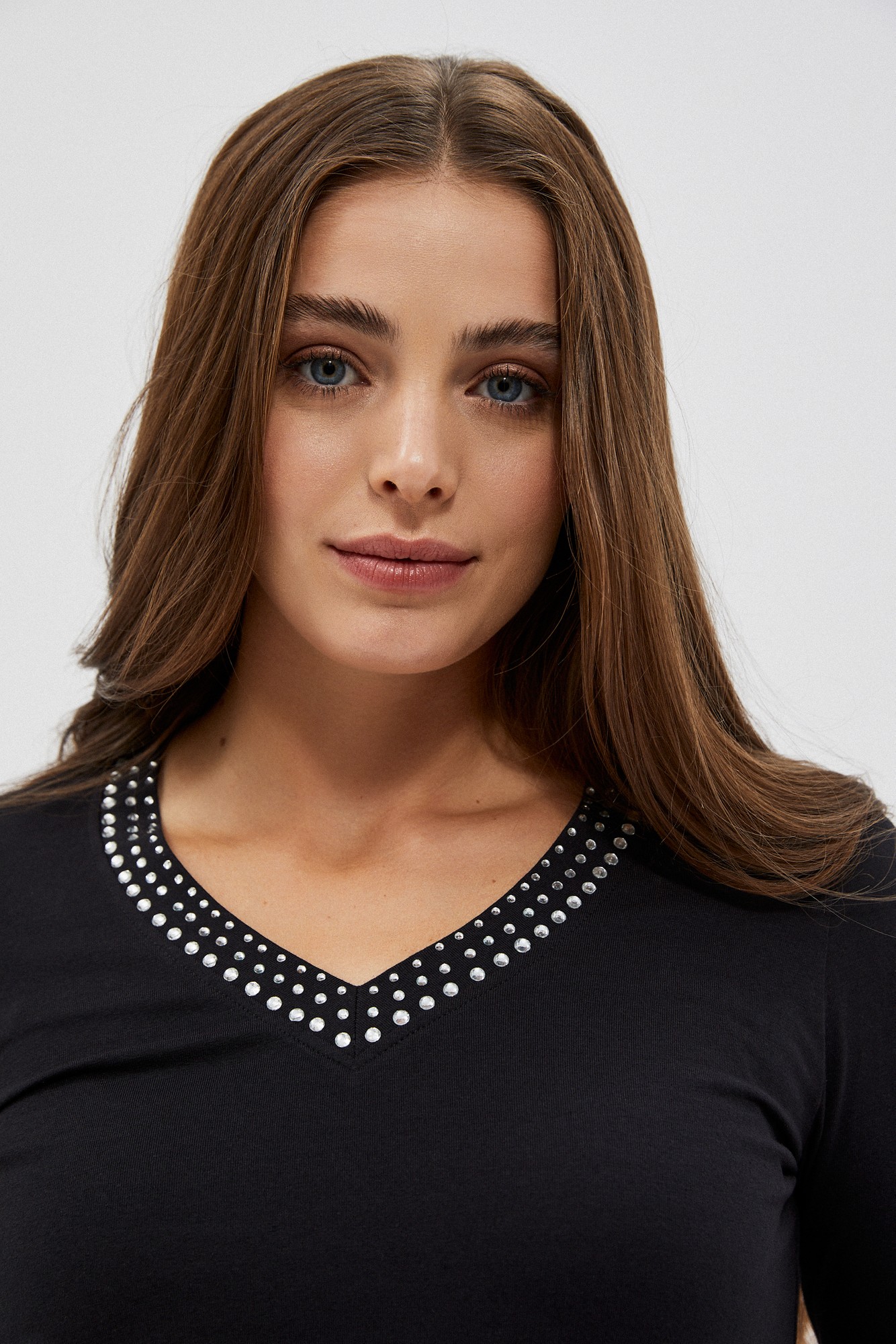 Plain blouse with a decorative neckline