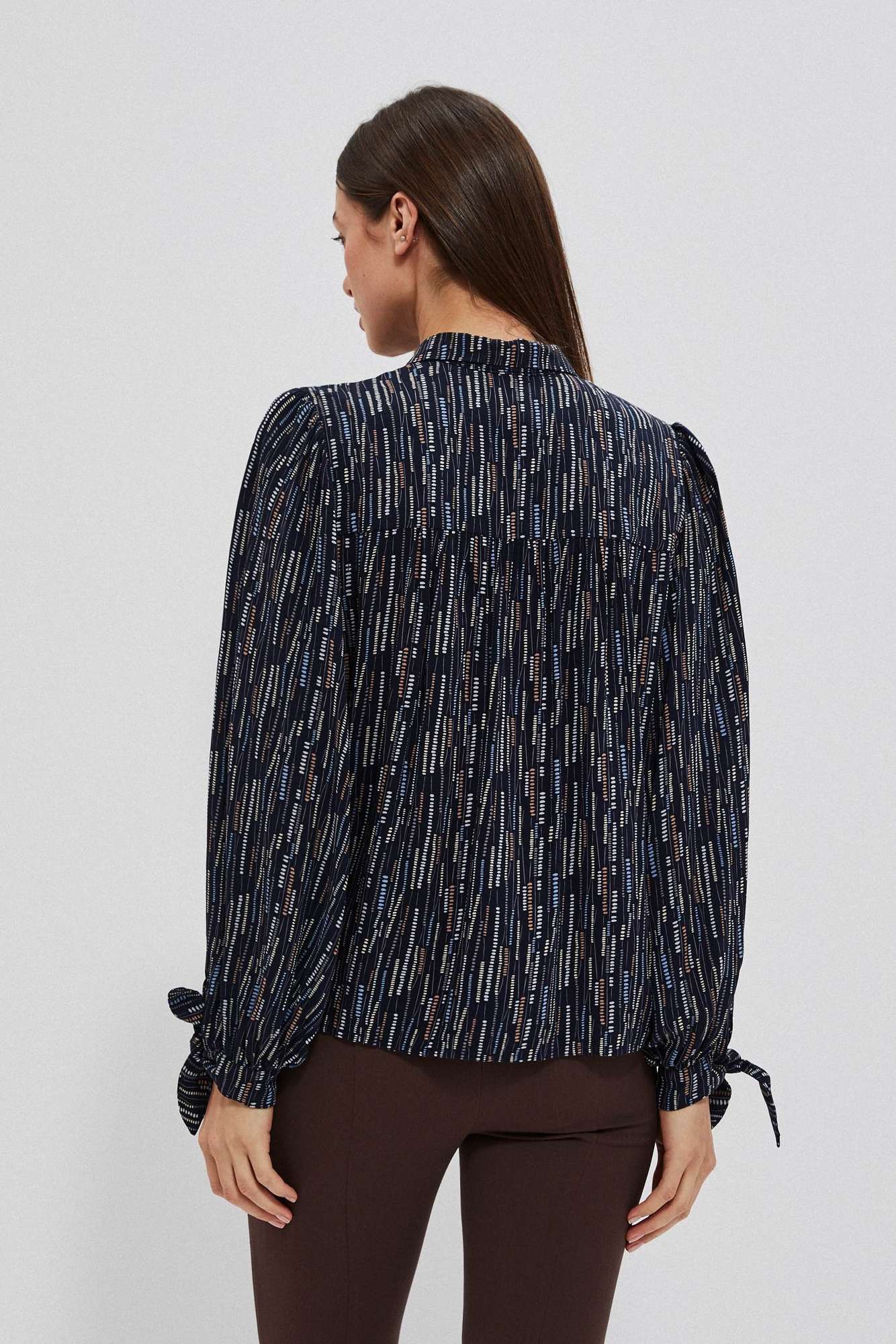 Women's shirt with tie on the sleeves