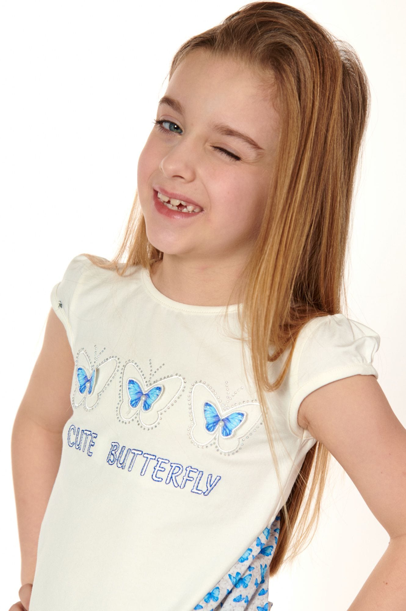 Girls' cream blouse with longer back
