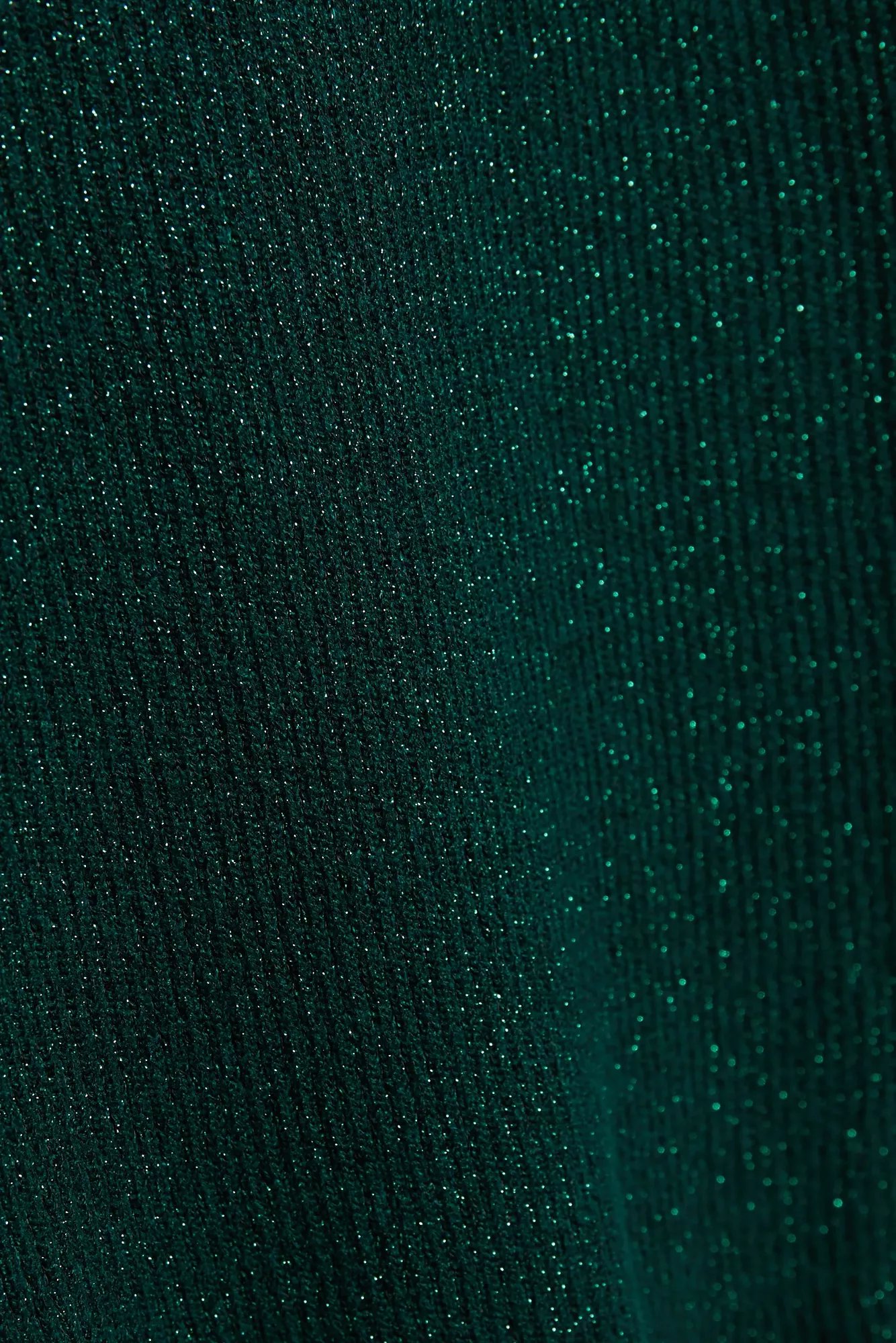 Turtleneck sweater decorated with metallic thread