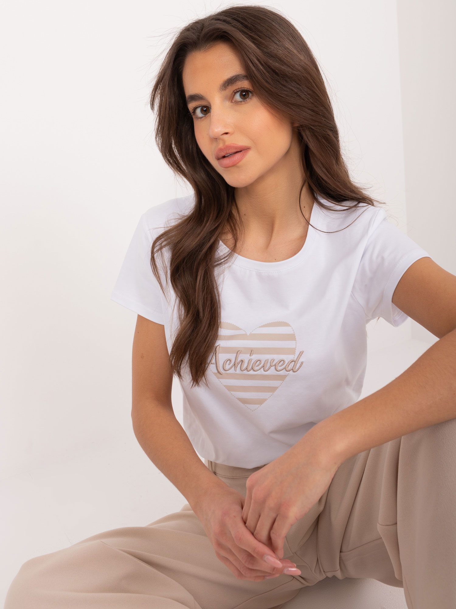 White-beige women's T-shirt with the inscription BASIC FEEL GOOD