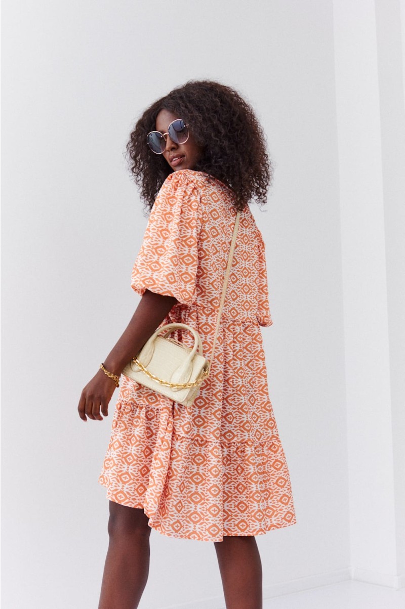 Loose dress with puff sleeves in light orange
