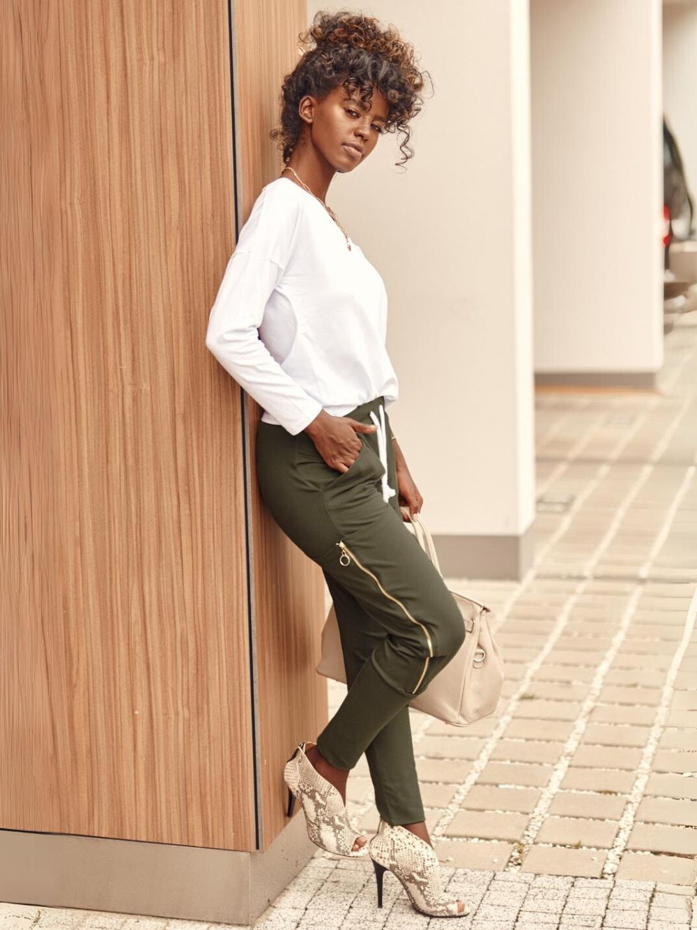 Set of women&#039;s cargo pants and white-khaki blouse