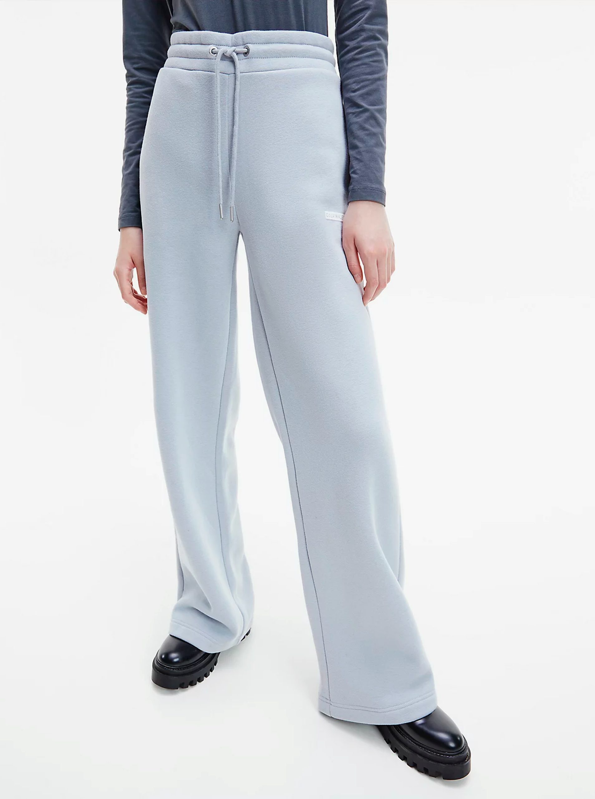 Levně Světle modré dámské volné tepláky Micro Flock Jog Pants Calvin Klein - Dámské