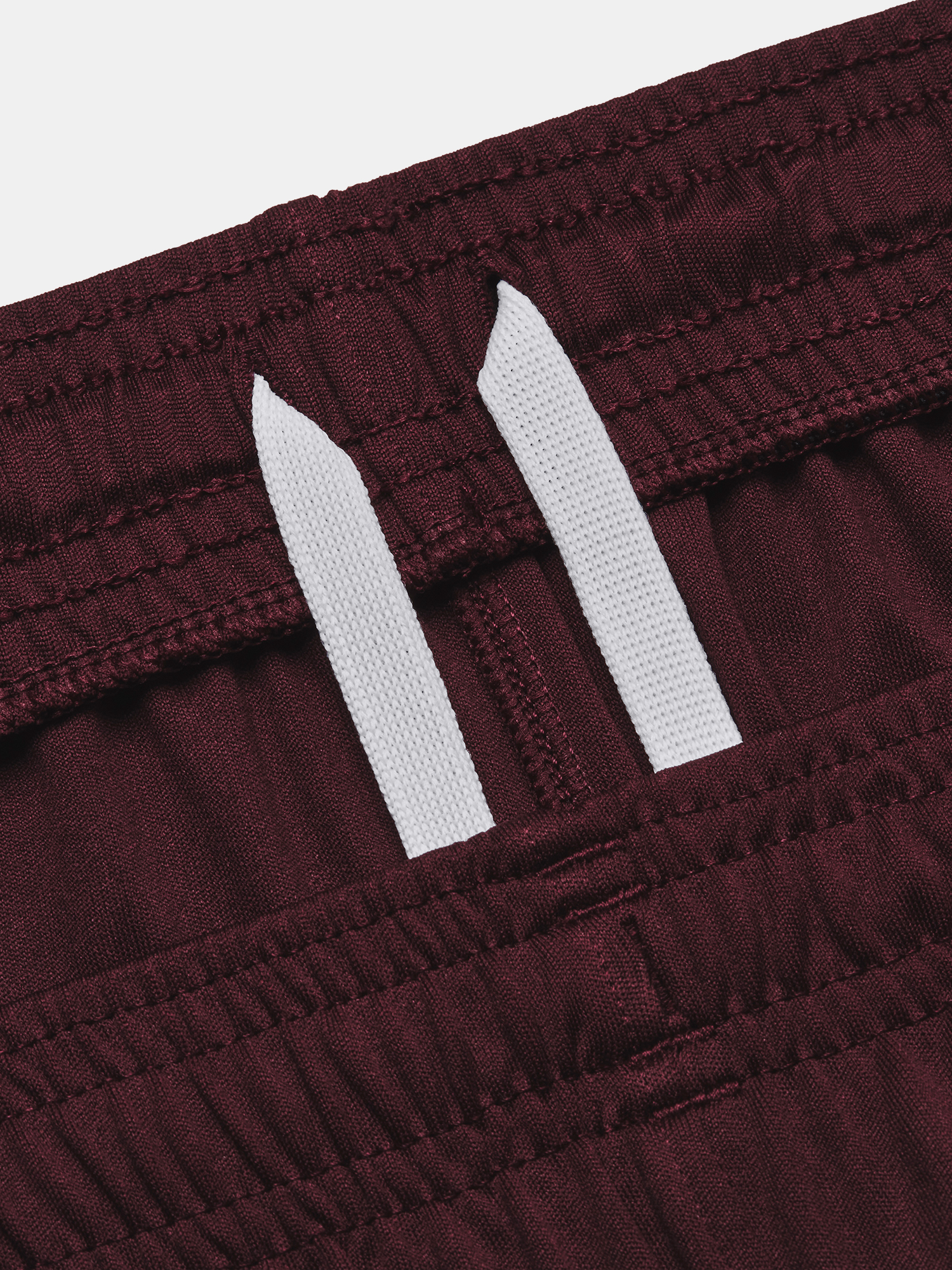 Pantaloni si pantaloni scurti pentru femei Under Armour - rosu