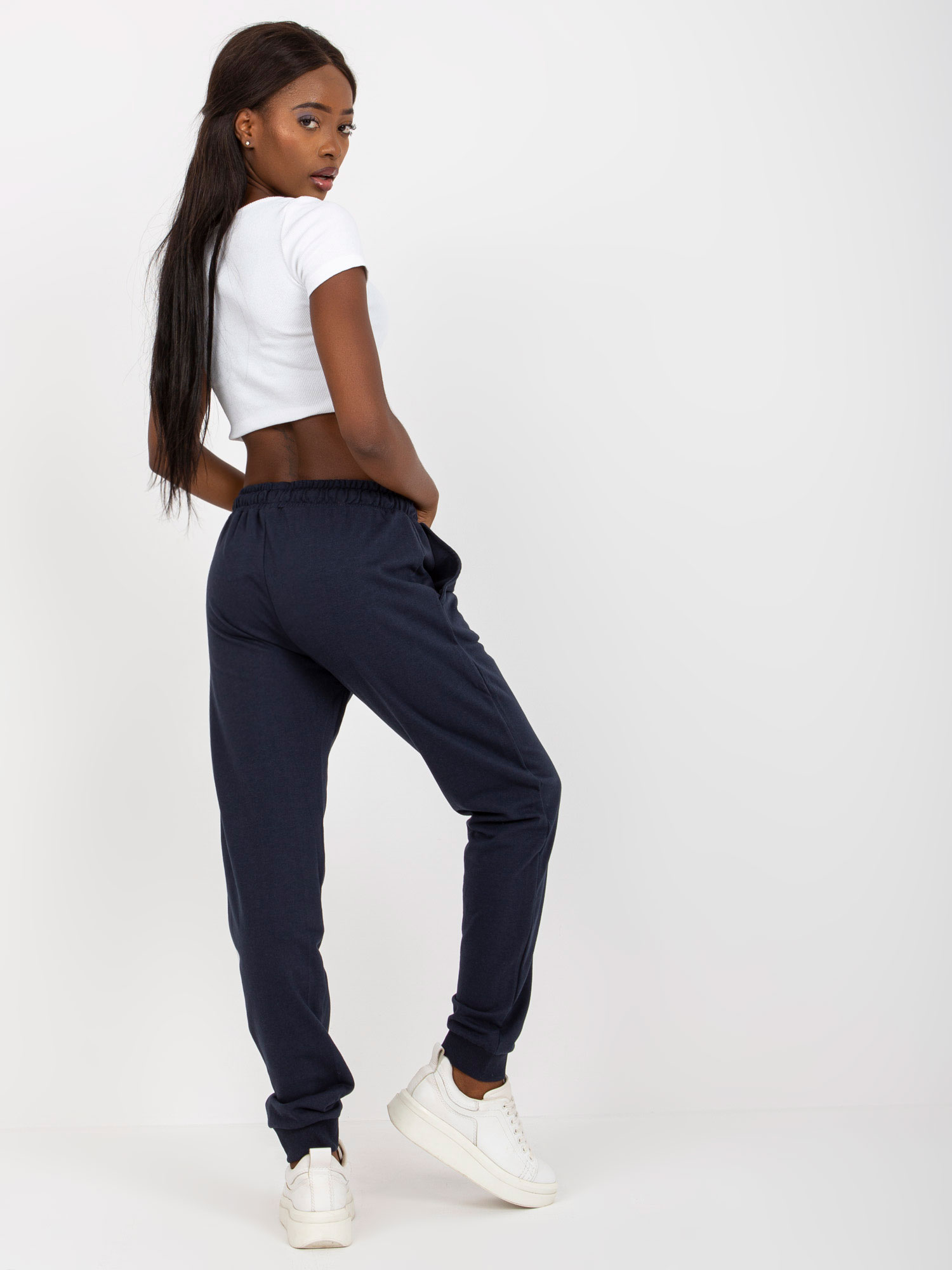 Navy blue sweatpants tied at the waist