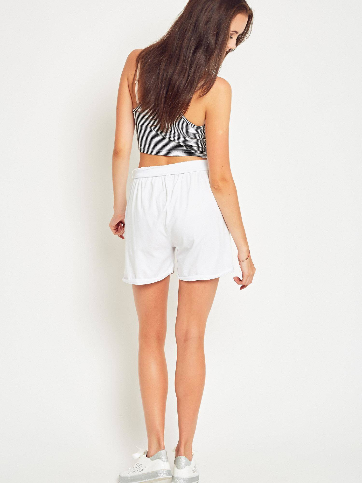 White shorts tied at the waist