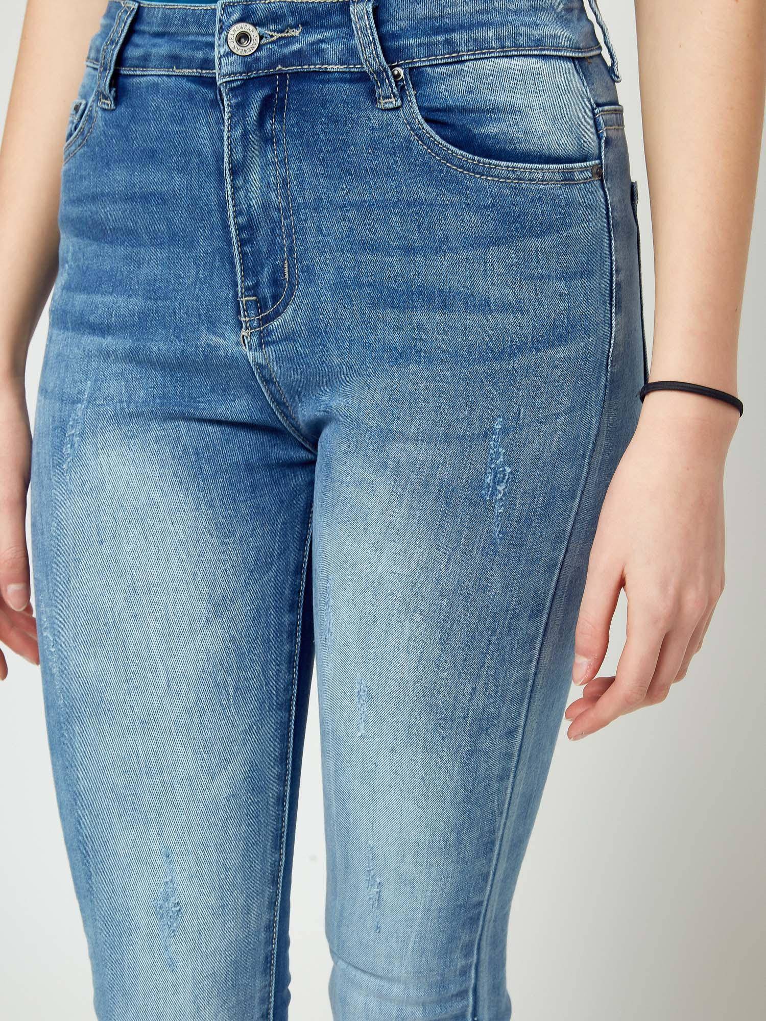 Jeans decorated with abrasions and pearls blue