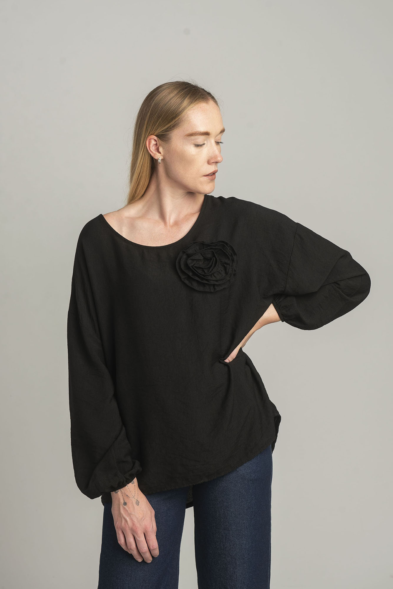 Black oversize blouse with a decorative flower