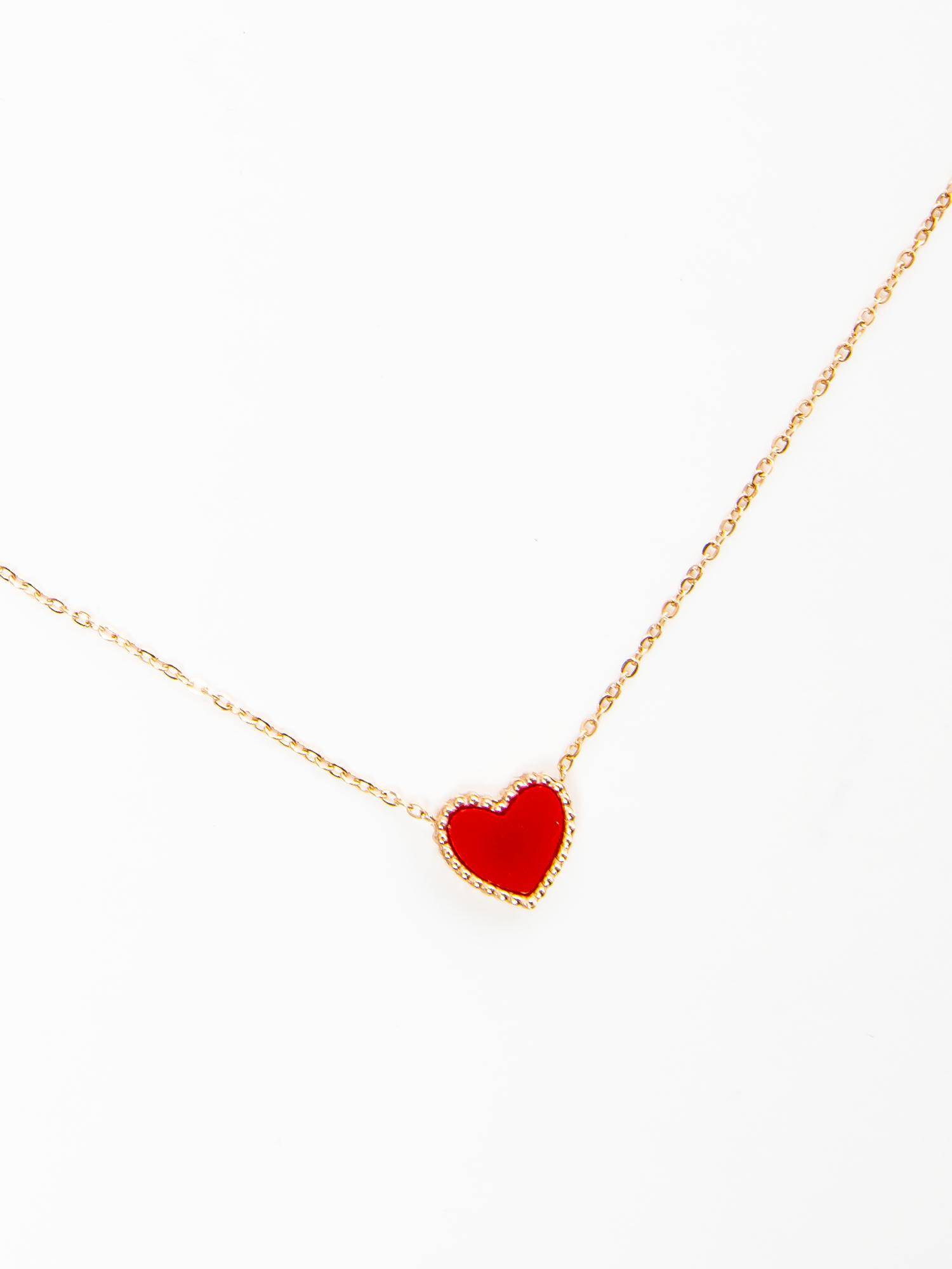 Gold necklace with red heart