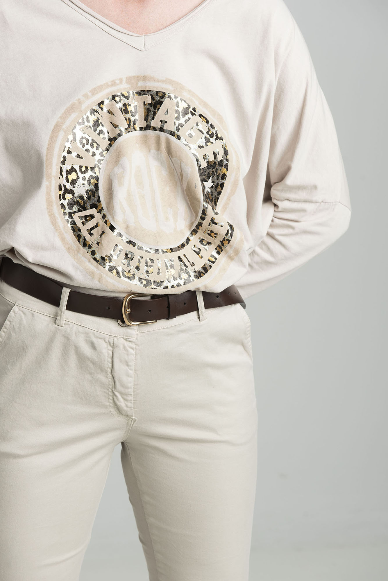 Beige oversize blouse with a shiny print