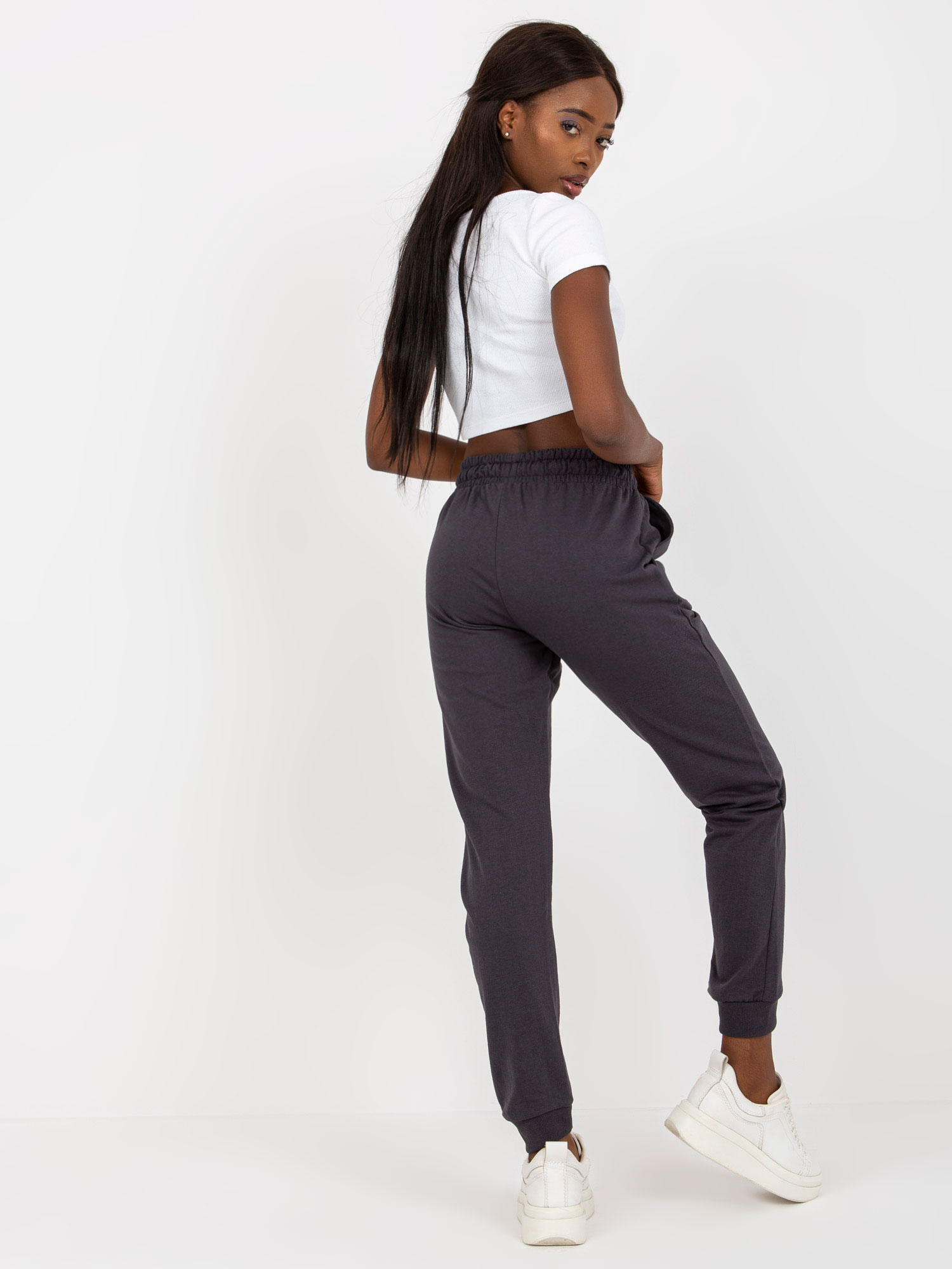 Graphite sweatpants tied at the waist