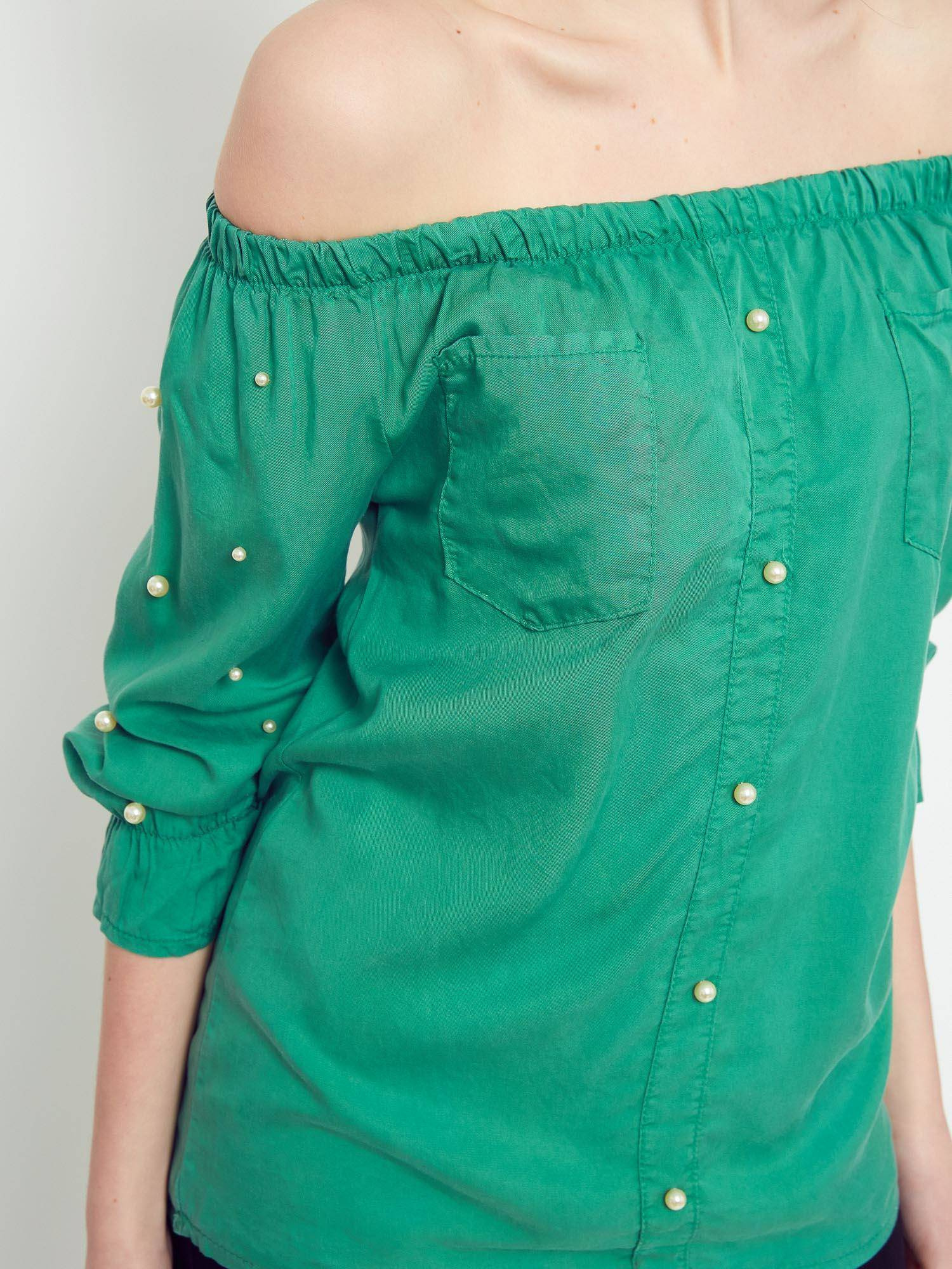 Blouse with pearls revealing shoulders green