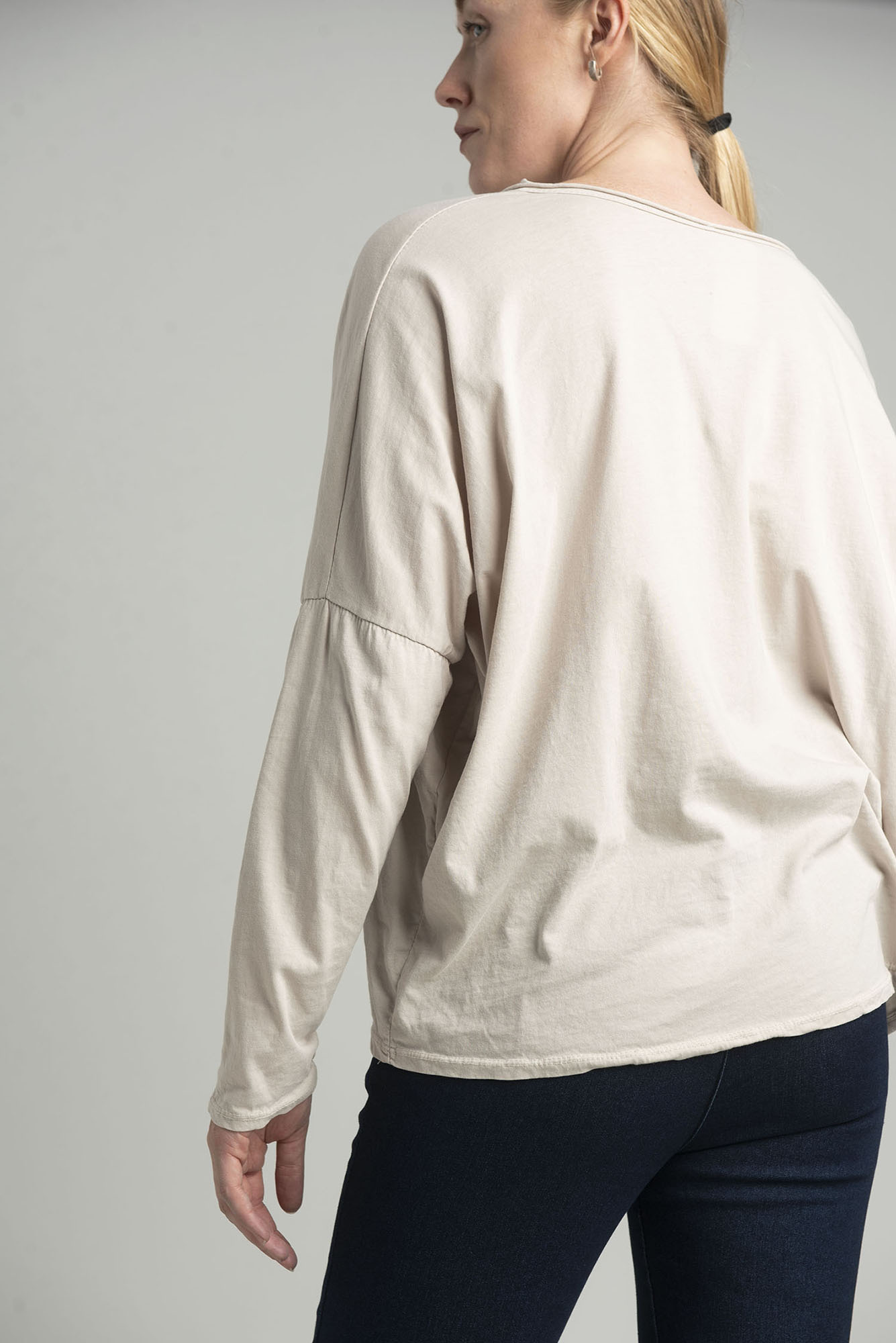 Beige oversize blouse with a shiny print