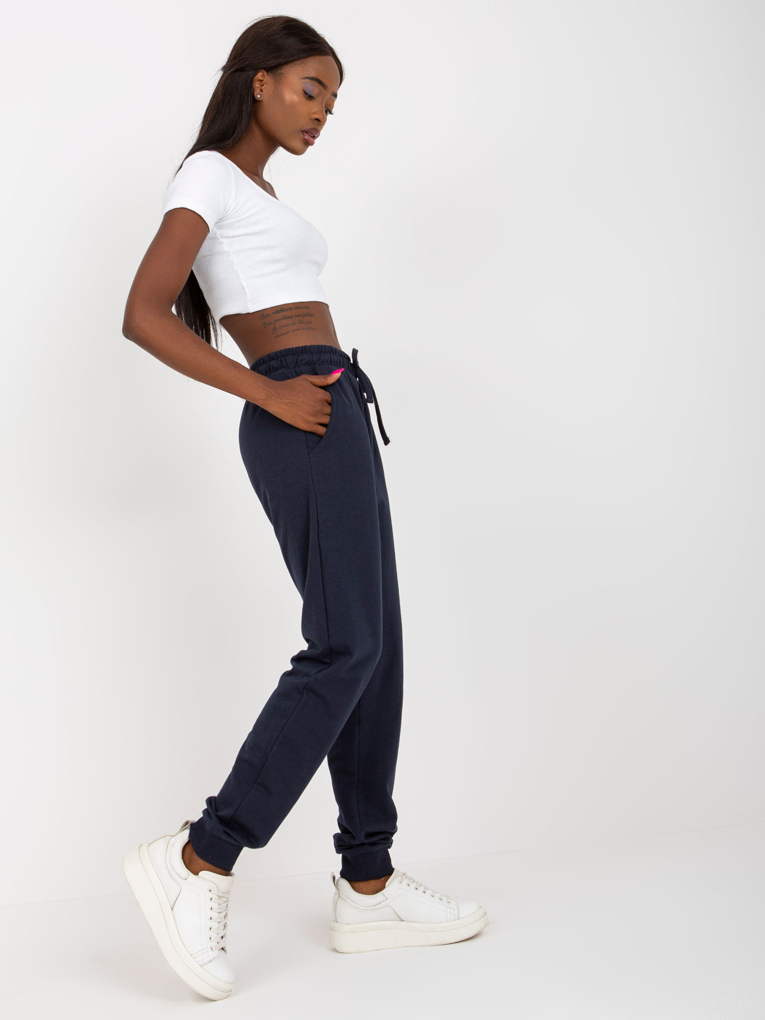 Navy blue sweatpants tied at the waist