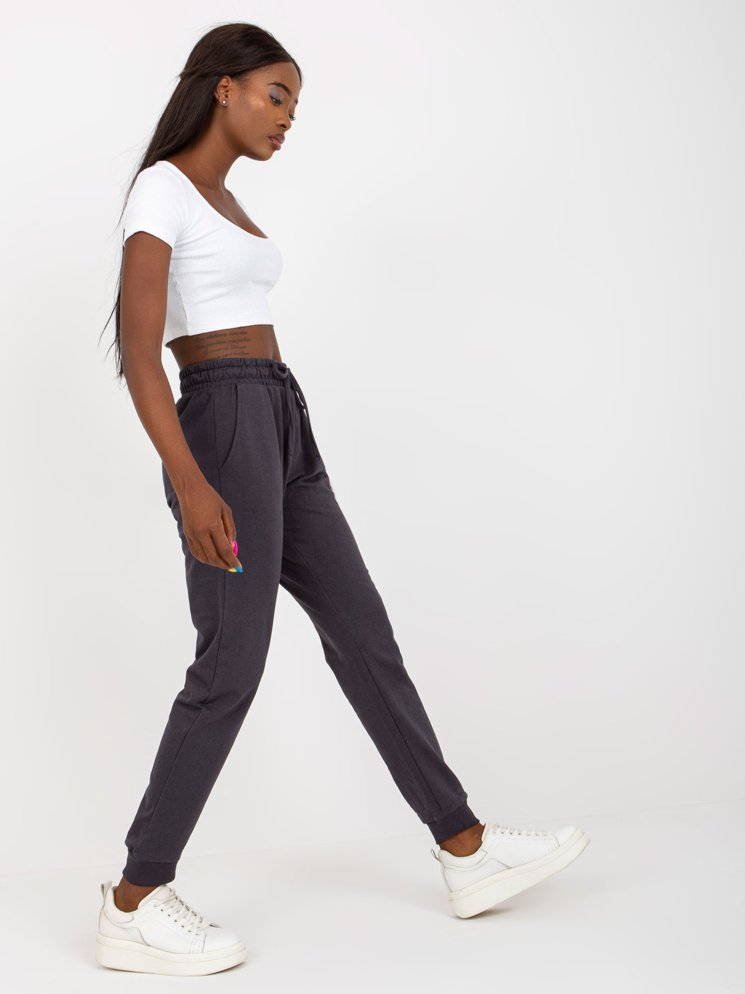 Graphite sweatpants tied at the waist