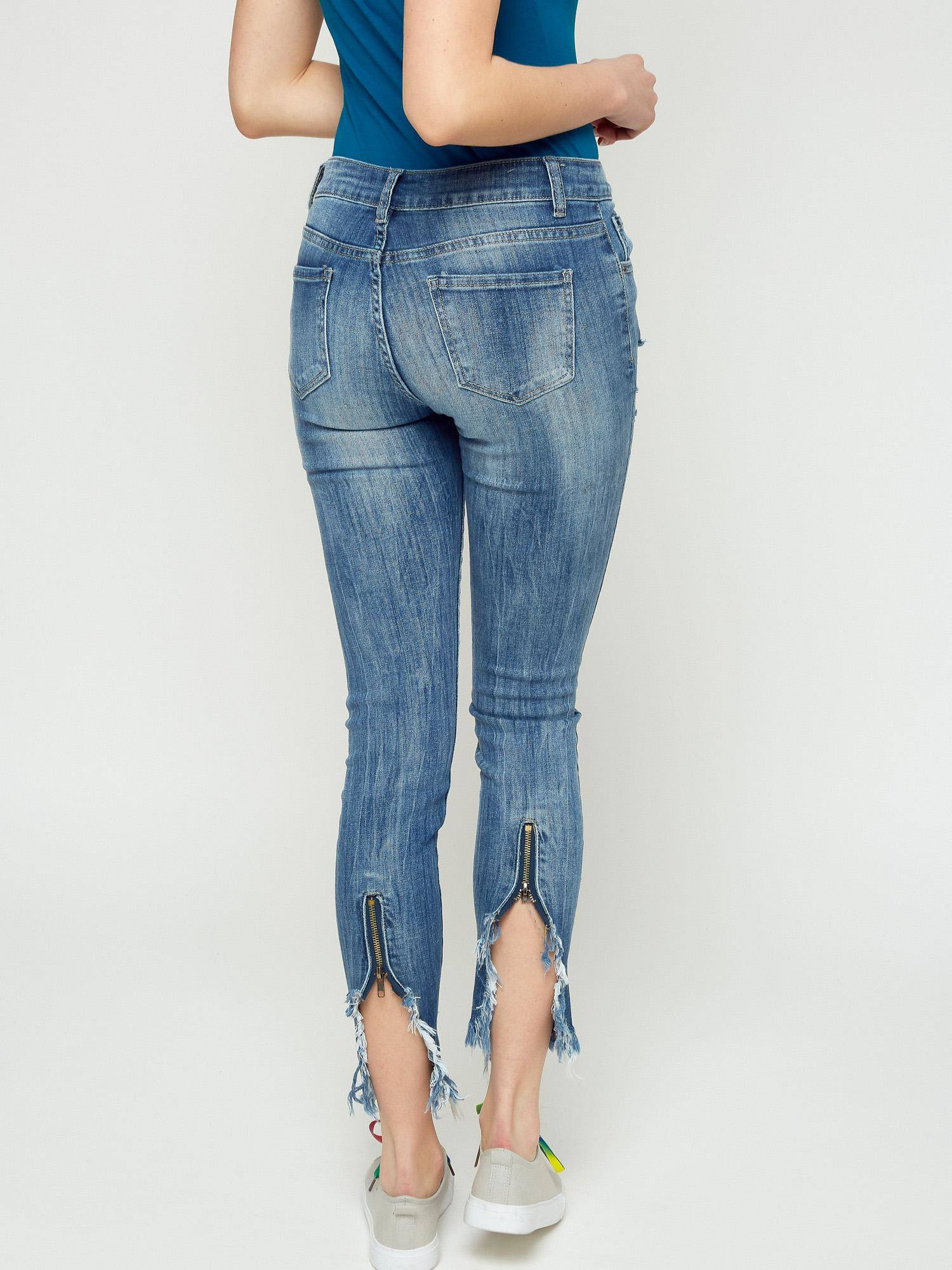 Jeans with tears and decorative zipper blue