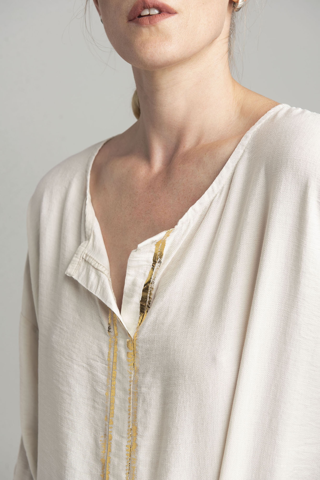 Ecru blouse with gold print