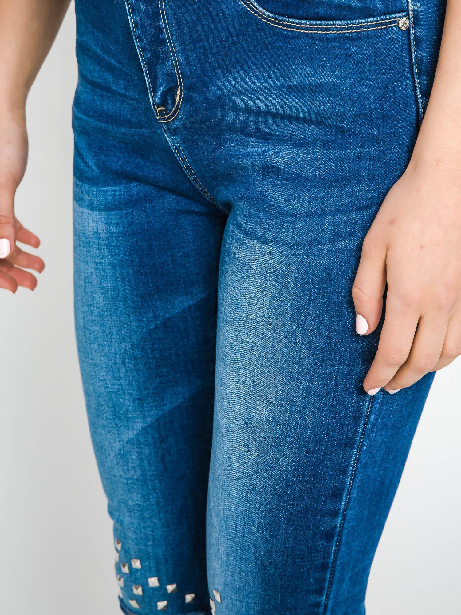 Jeans decorated with cuts and rhinestones on the knees navy blue