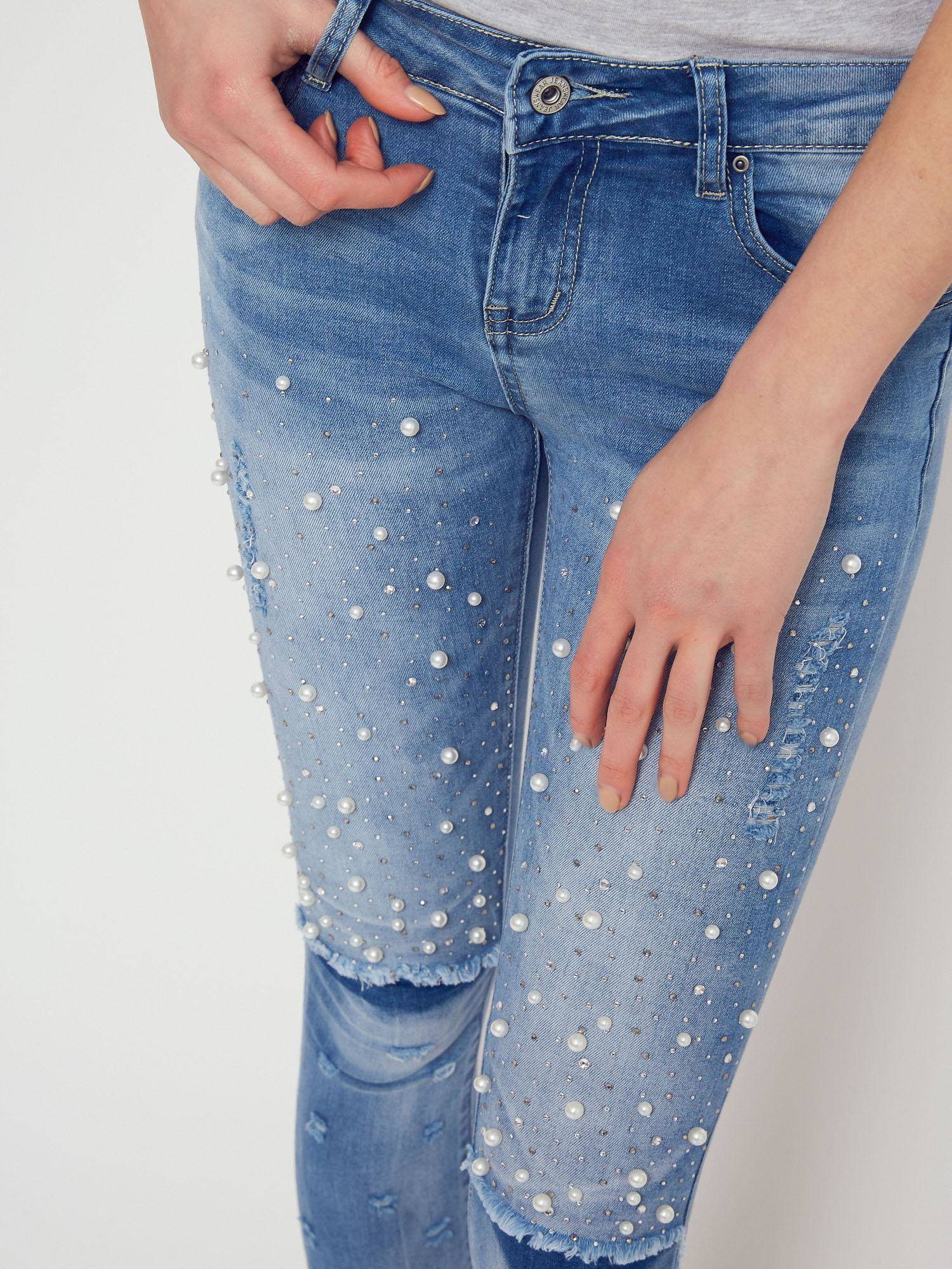 Denim jeans decorated with pearls and rhinestones blue