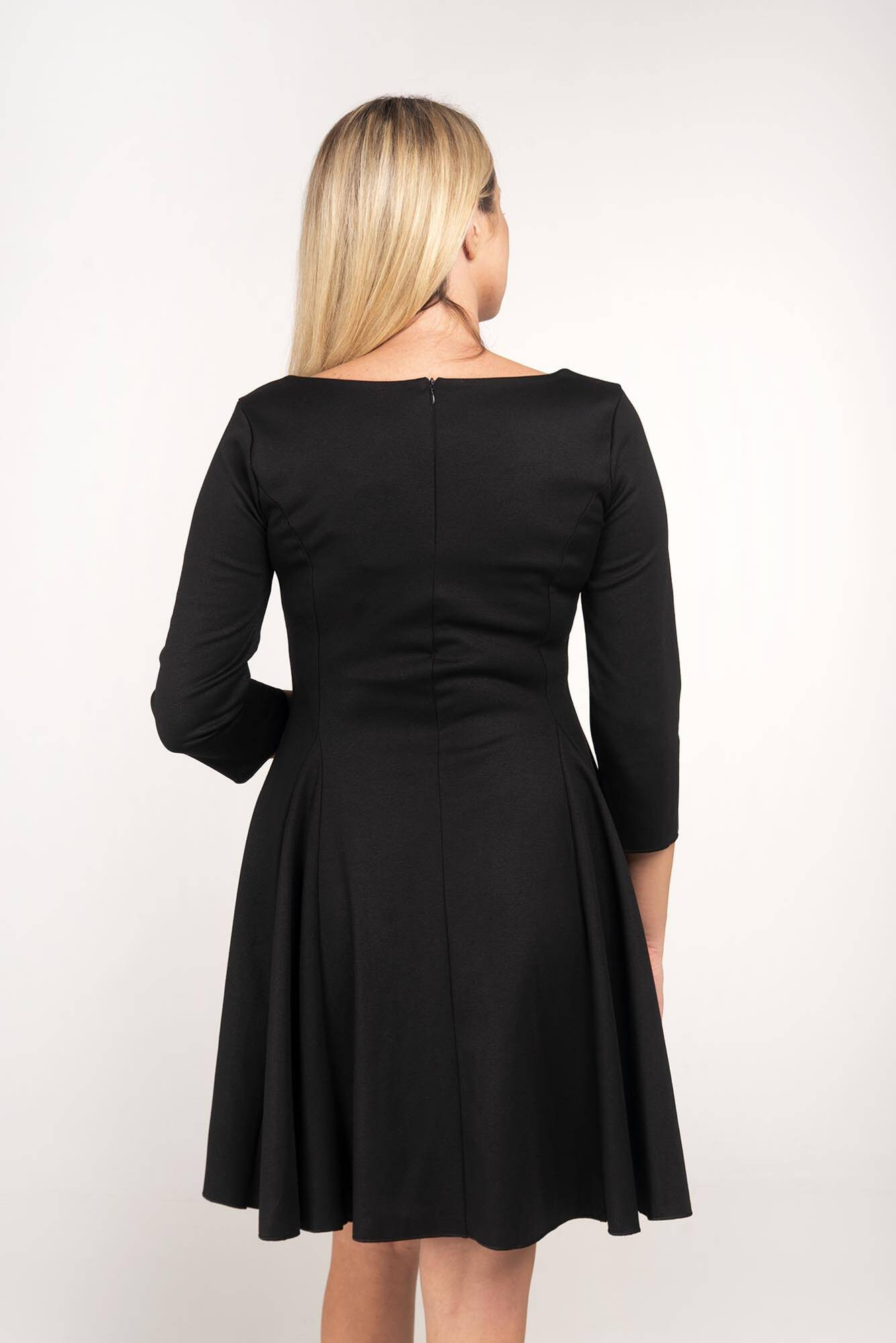 The black flared dress is ... Me