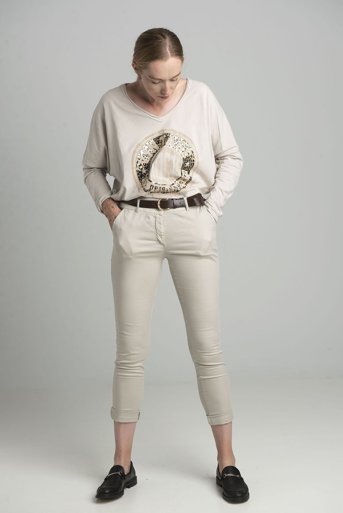 Beige oversize blouse with a shiny print