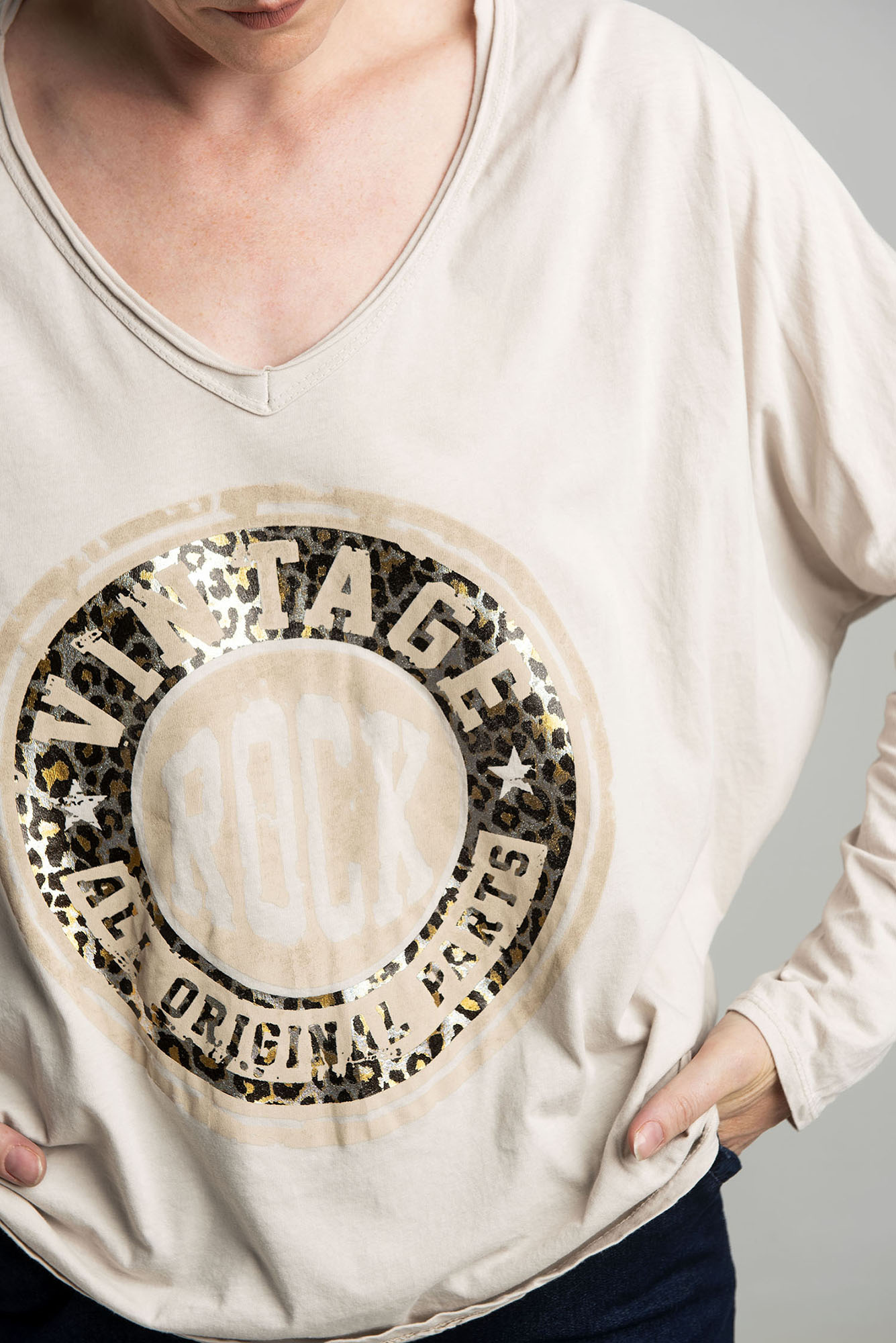 Beige oversize blouse with a shiny print
