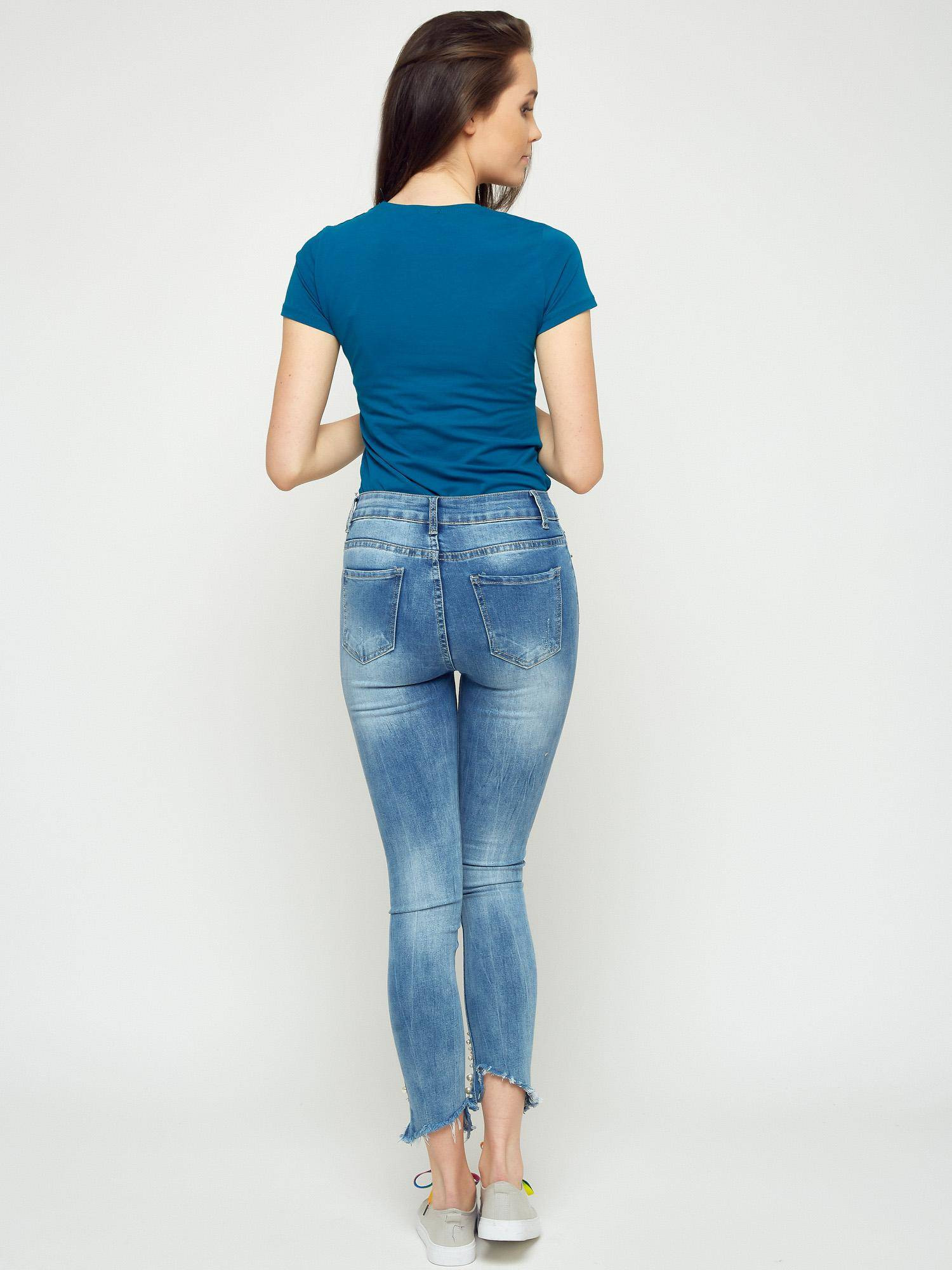 Jeans decorated with abrasions and pearls blue