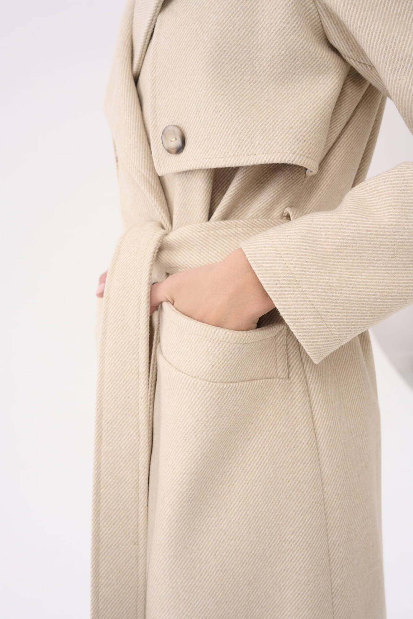 Beige double-breasted coat with Blue Shadow belt