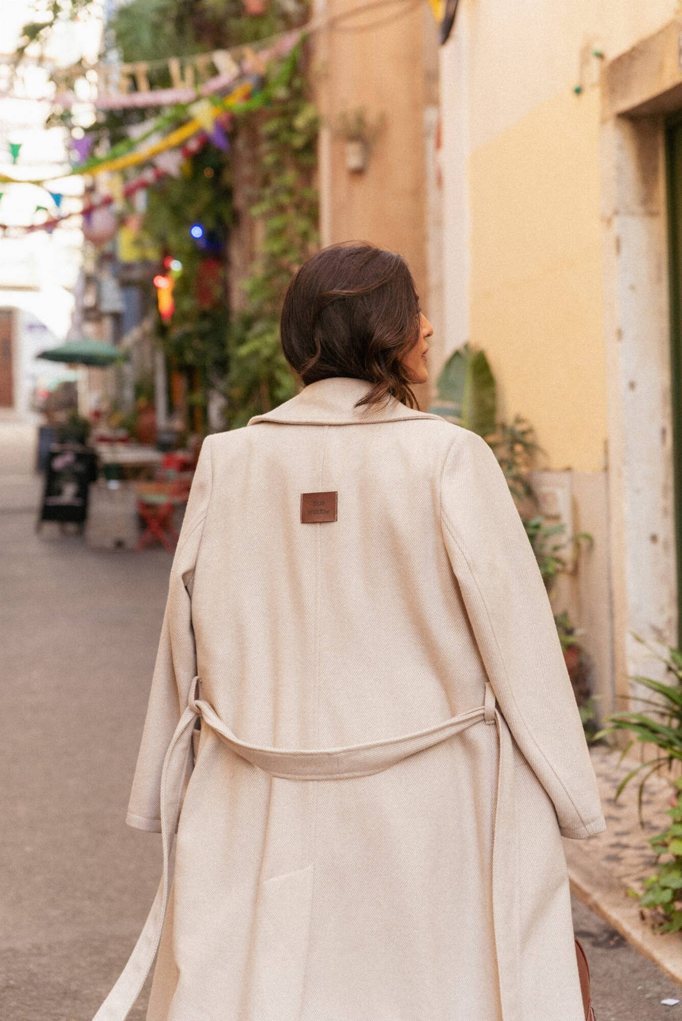 Beige double-breasted coat with Blue Shadow belt