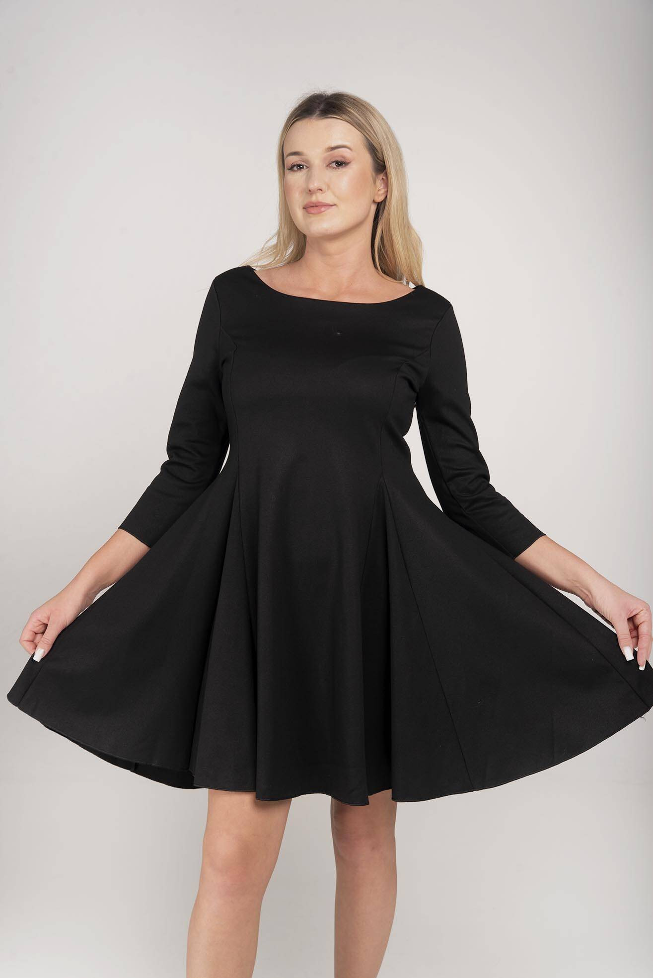 The black flared dress is ... Me