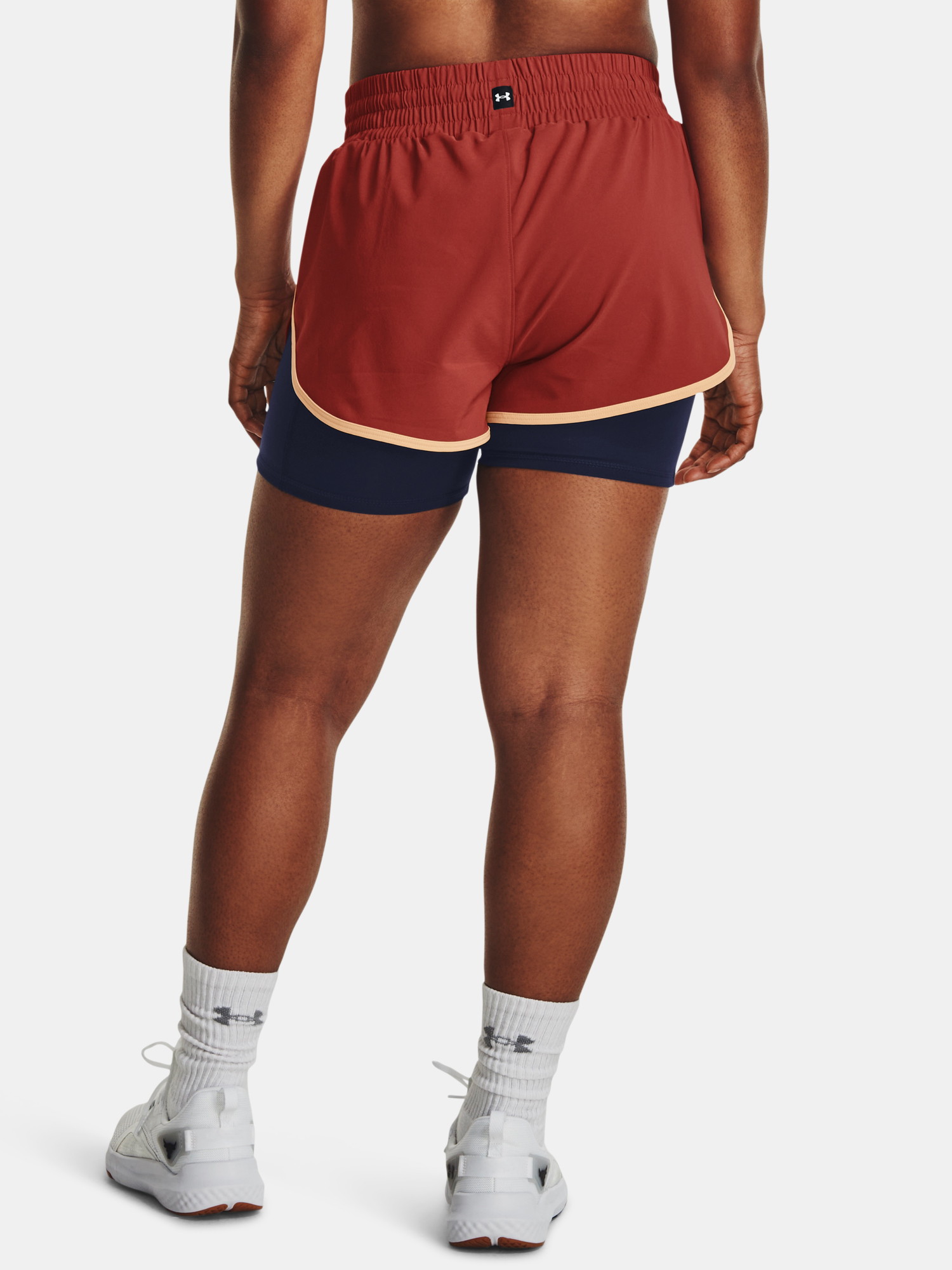 Nohavice a kraťasy pre ženy Under Armour - červená