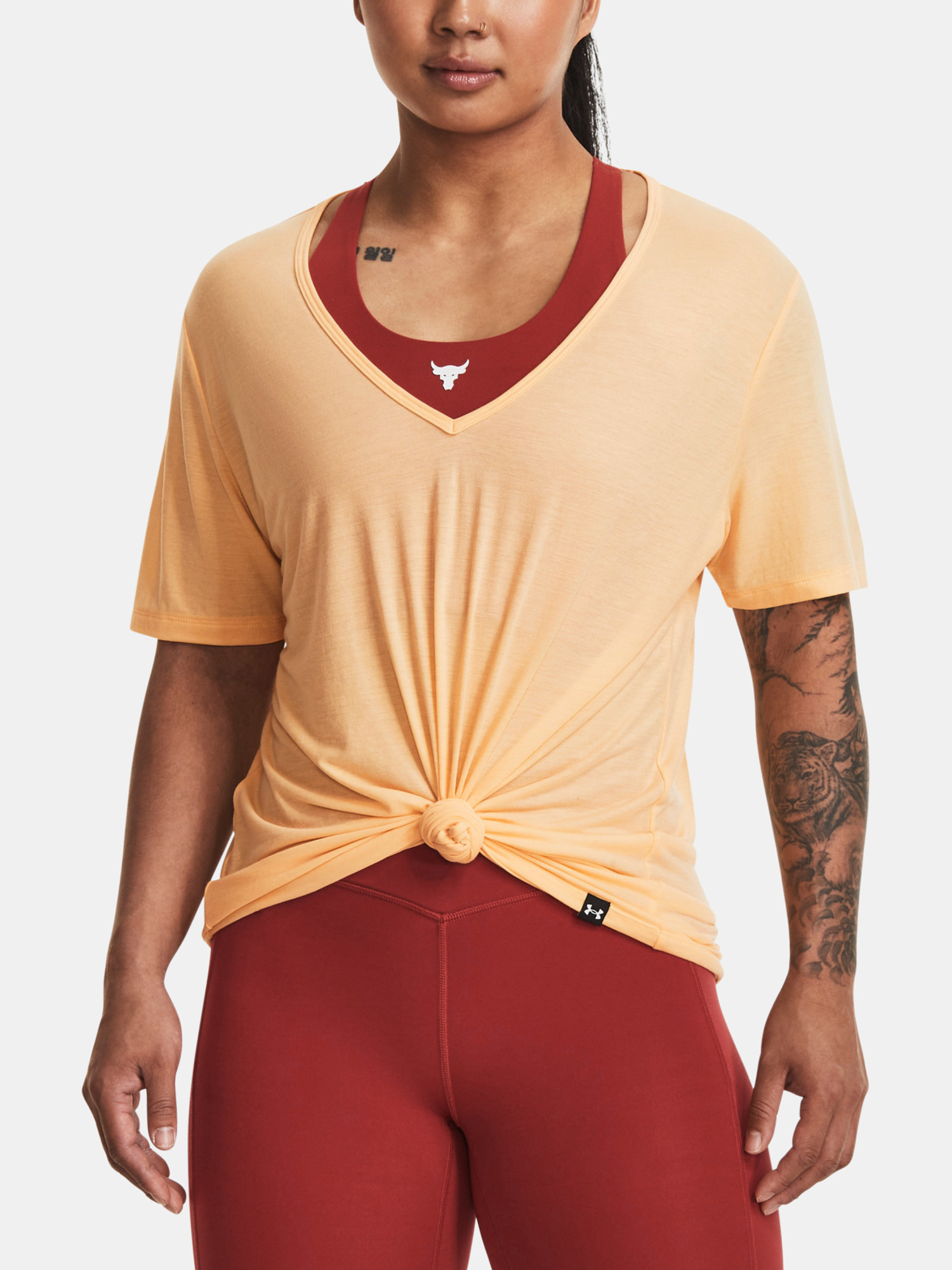 Meruňkové dámské sportovní tričko Under Armour Rock Completer