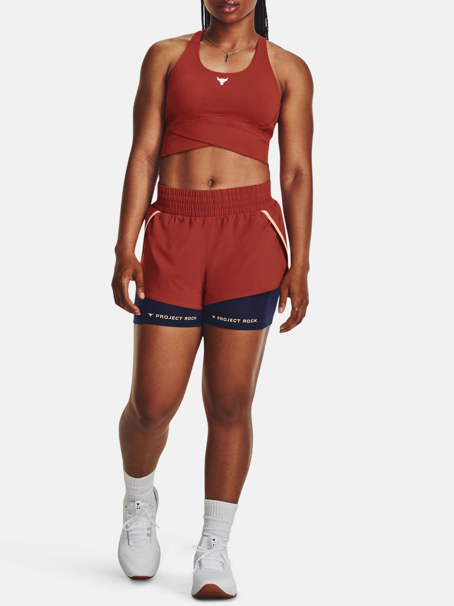 Nohavice a kraťasy pre ženy Under Armour - červená