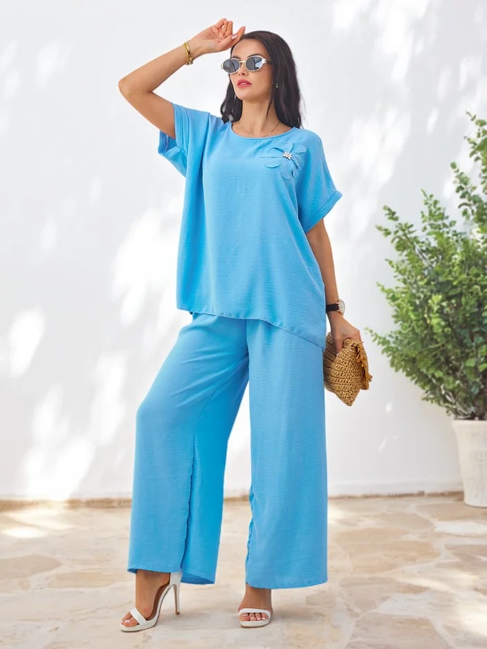 Resti Women's set with short sleeves, decorative flower, and wide pants