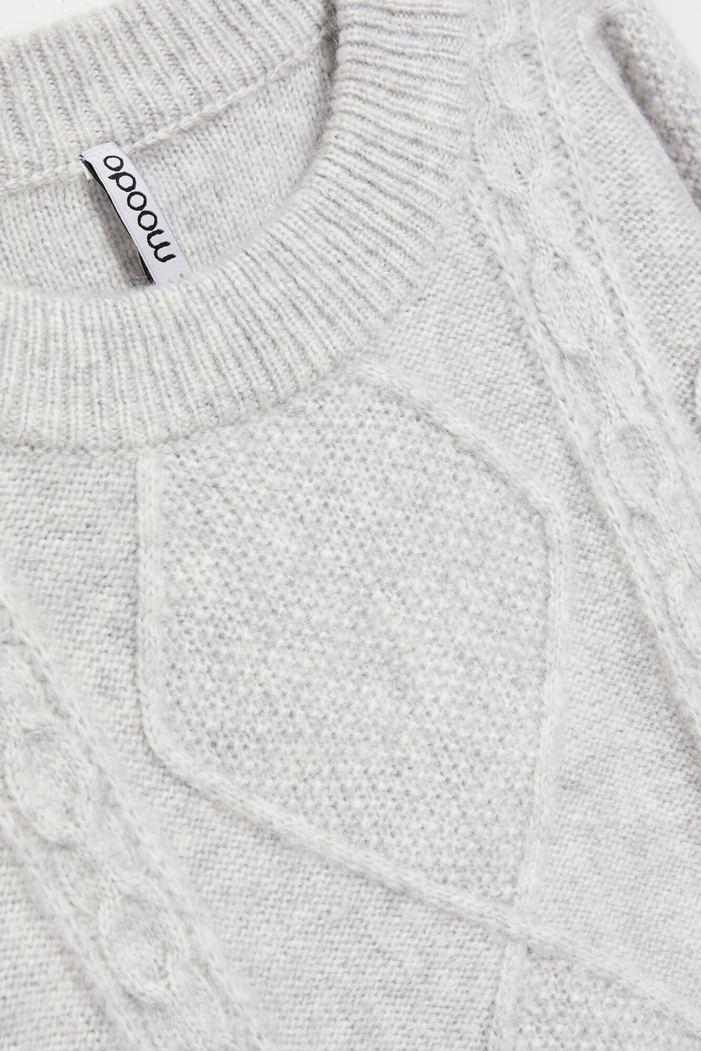 Sweater with decorative fabric