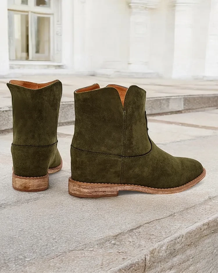 Resti Cowboy-style ankle boots on a covered wedge Blueston