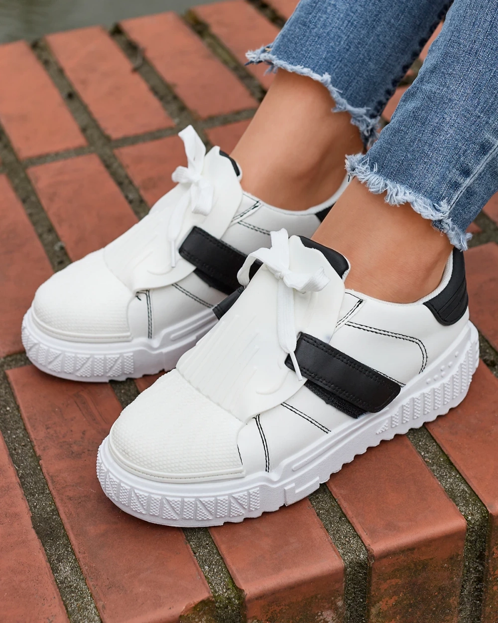 Resti Black and white women&#039;s sports shoes with rubber inserts Inika - Footwear