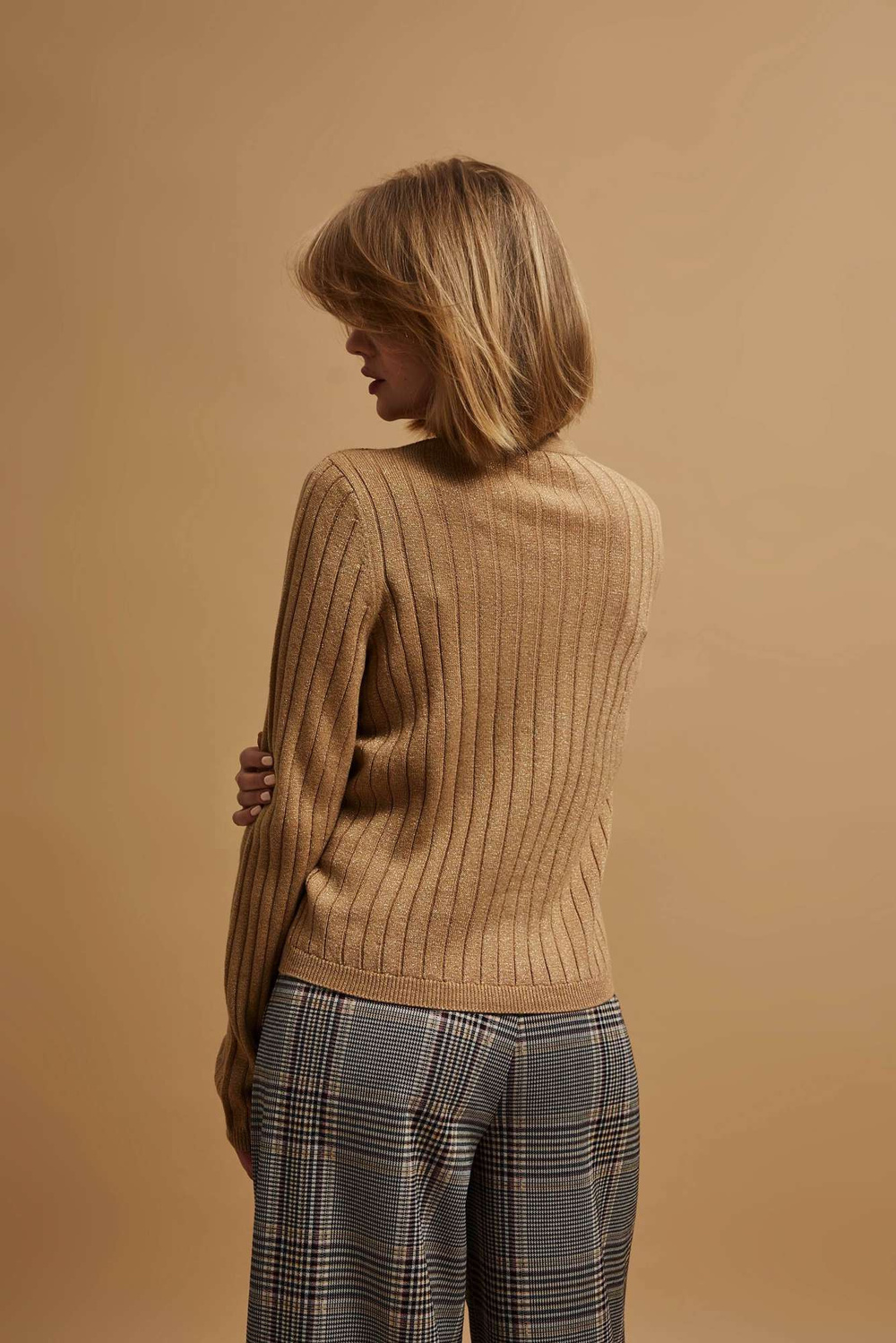 Sweater decorated with metallic thread