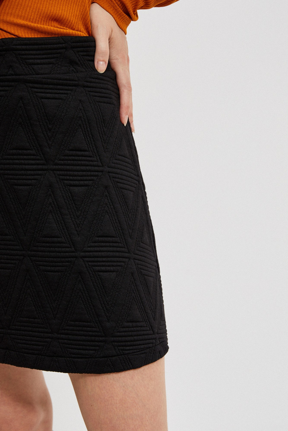 Mini skirt with geometric embossing