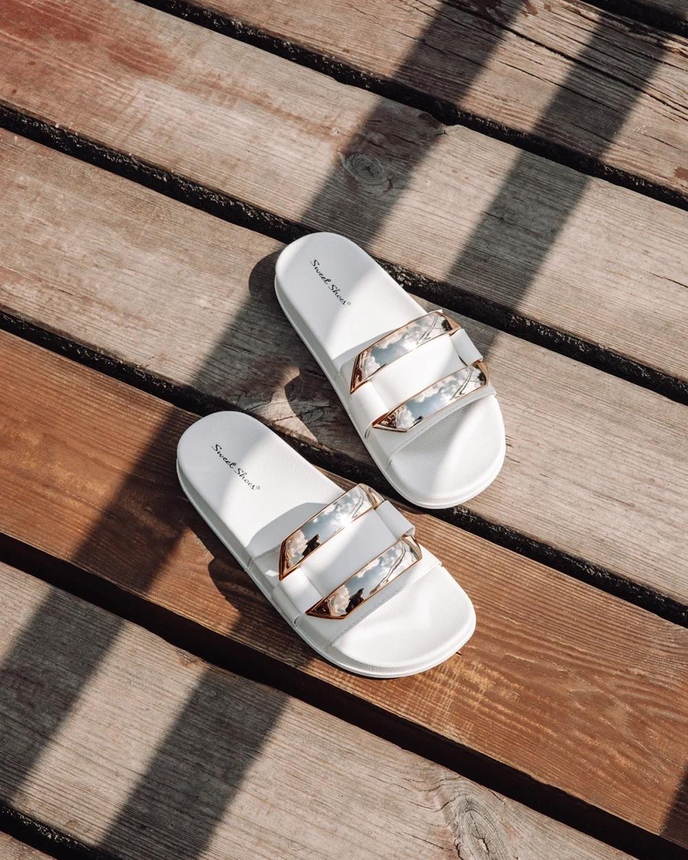 Resti Women's white slippers with golden Serina ornament - Footwear