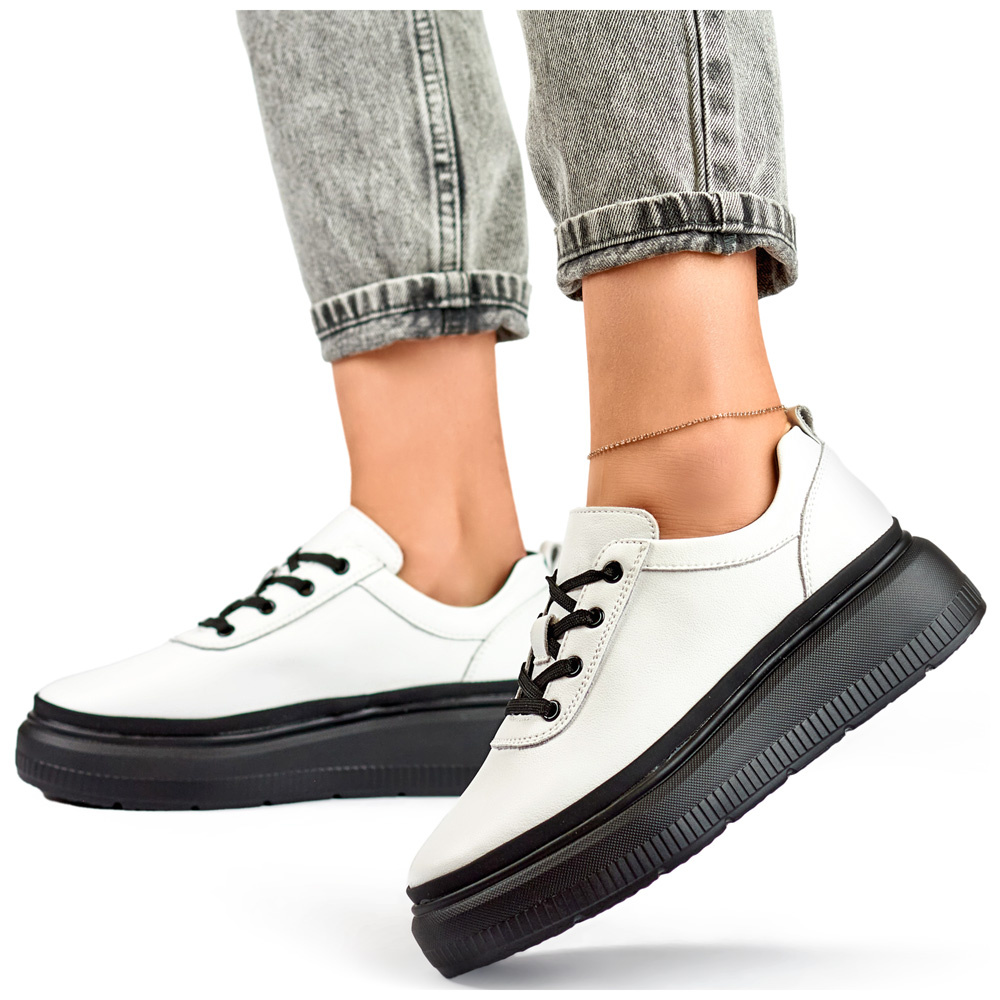 primohurt Skórzane białe sneakersy damskie z czarną podeszwą