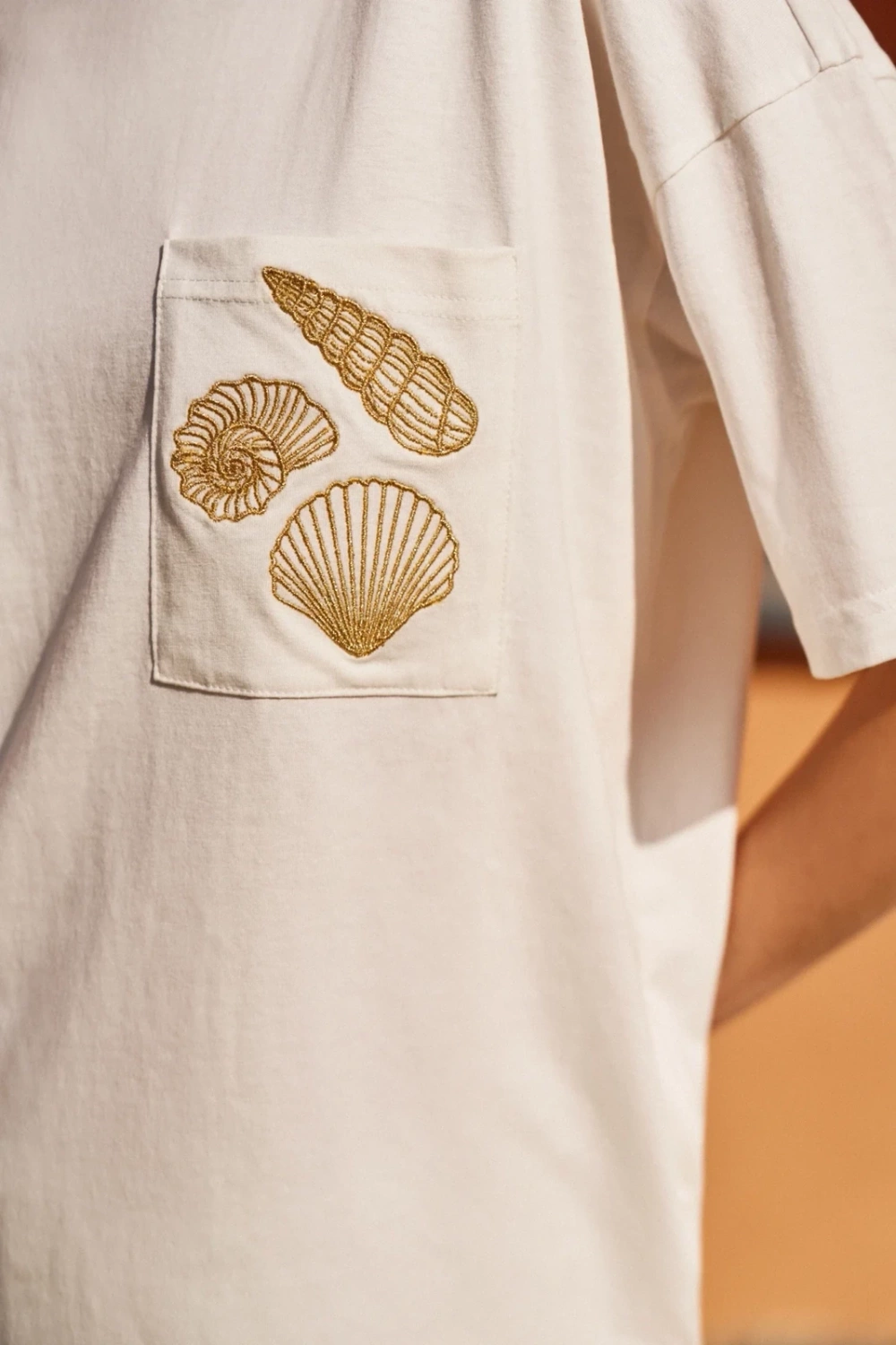 Marisse White T-Shirt With A Hat On The Pocket