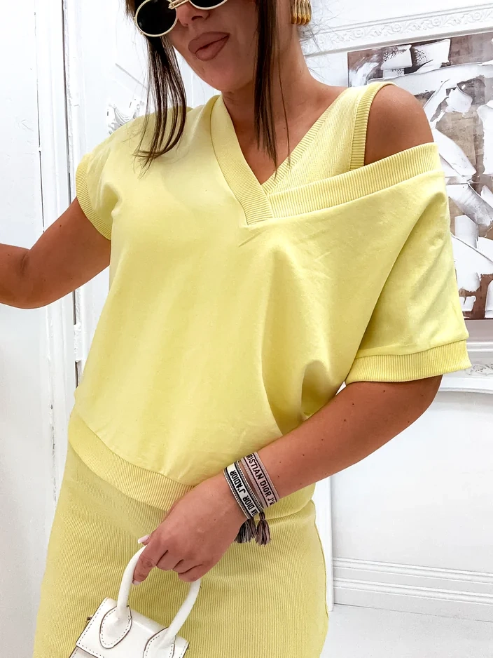 Resti Women's set with a revealing sweatshirt and knee-length dress