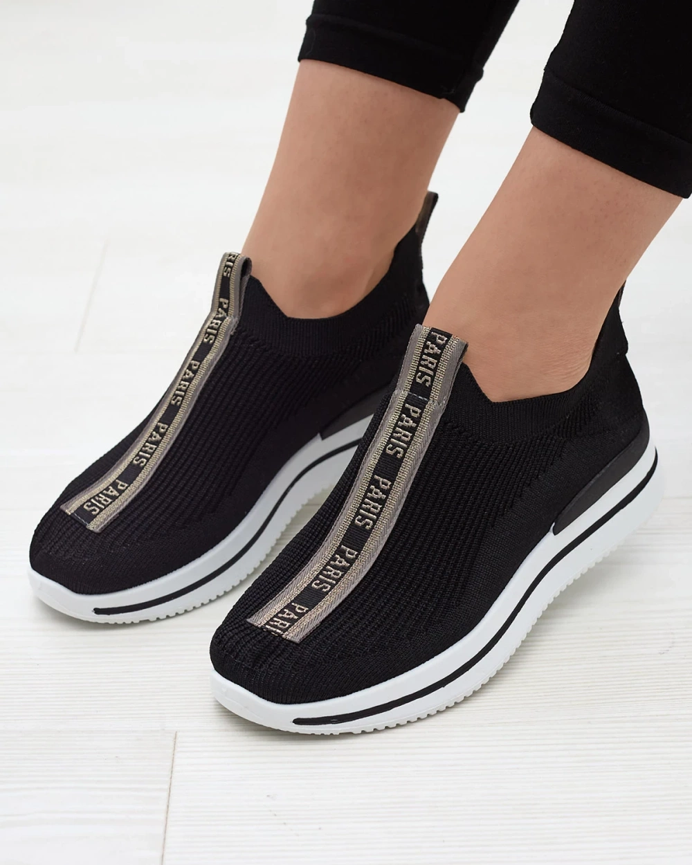 Resti Women&#039;s slip-on sports shoes with lettering in black Cerppa- Footwear