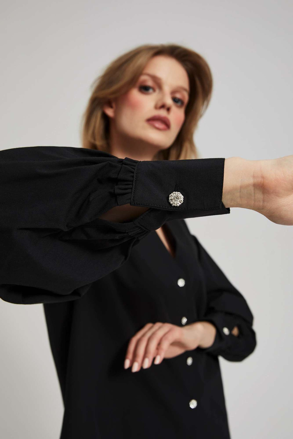 Shirt with decorative buttons