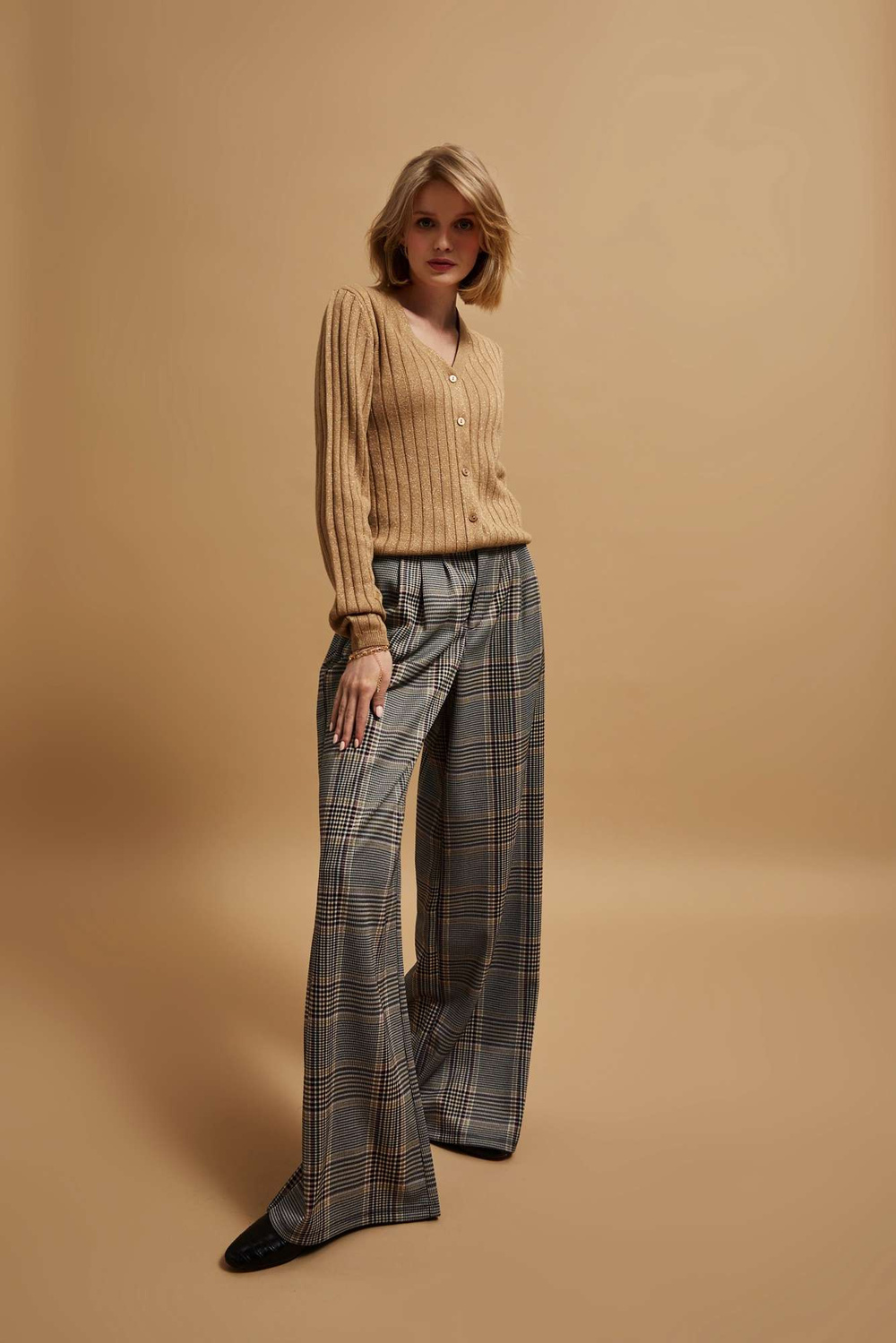 Sweater decorated with metallic thread