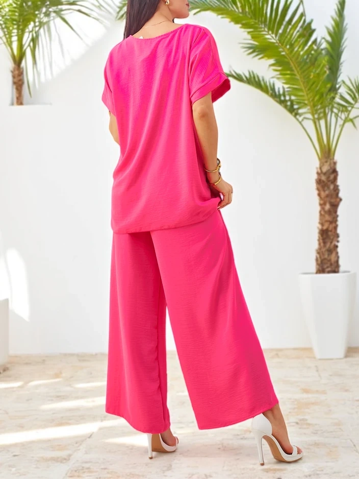 Resti Women's set with short sleeves, decorative flower, and wide trousers