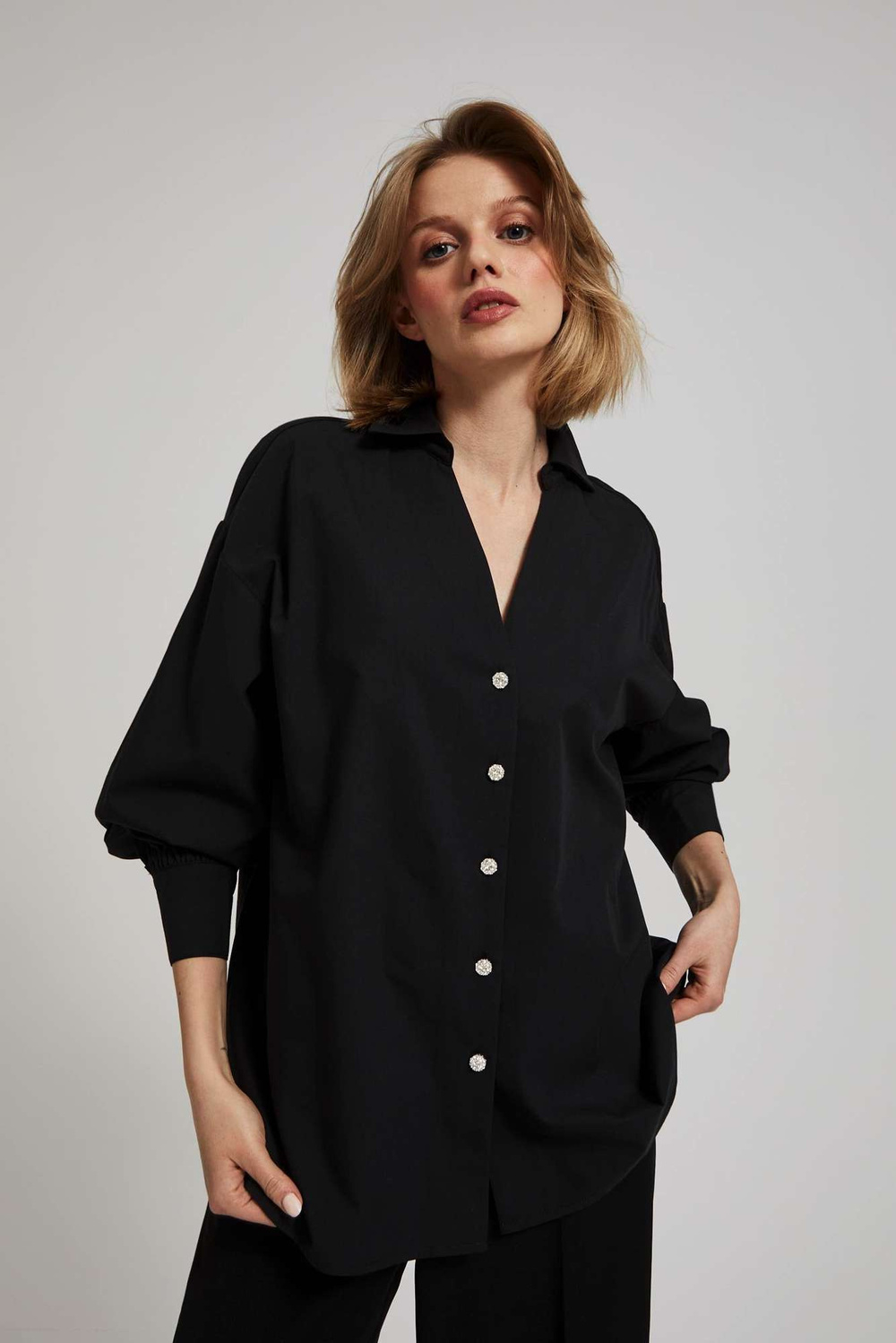 Shirt with decorative buttons