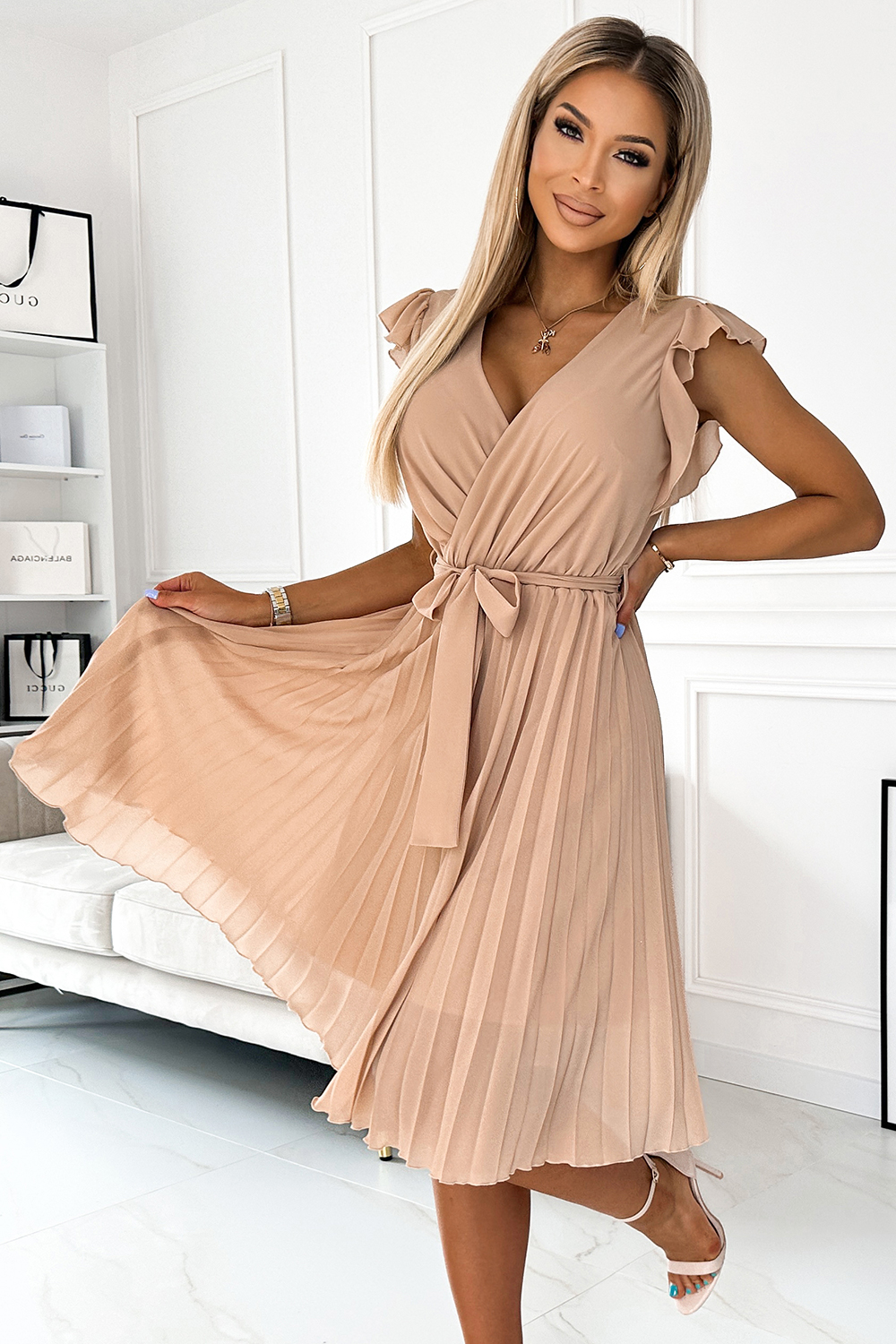 Numoco pleated dress with neckline and ruffles
